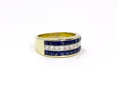 18 Karat Sapphire and Diamond Invisibly Set Ring