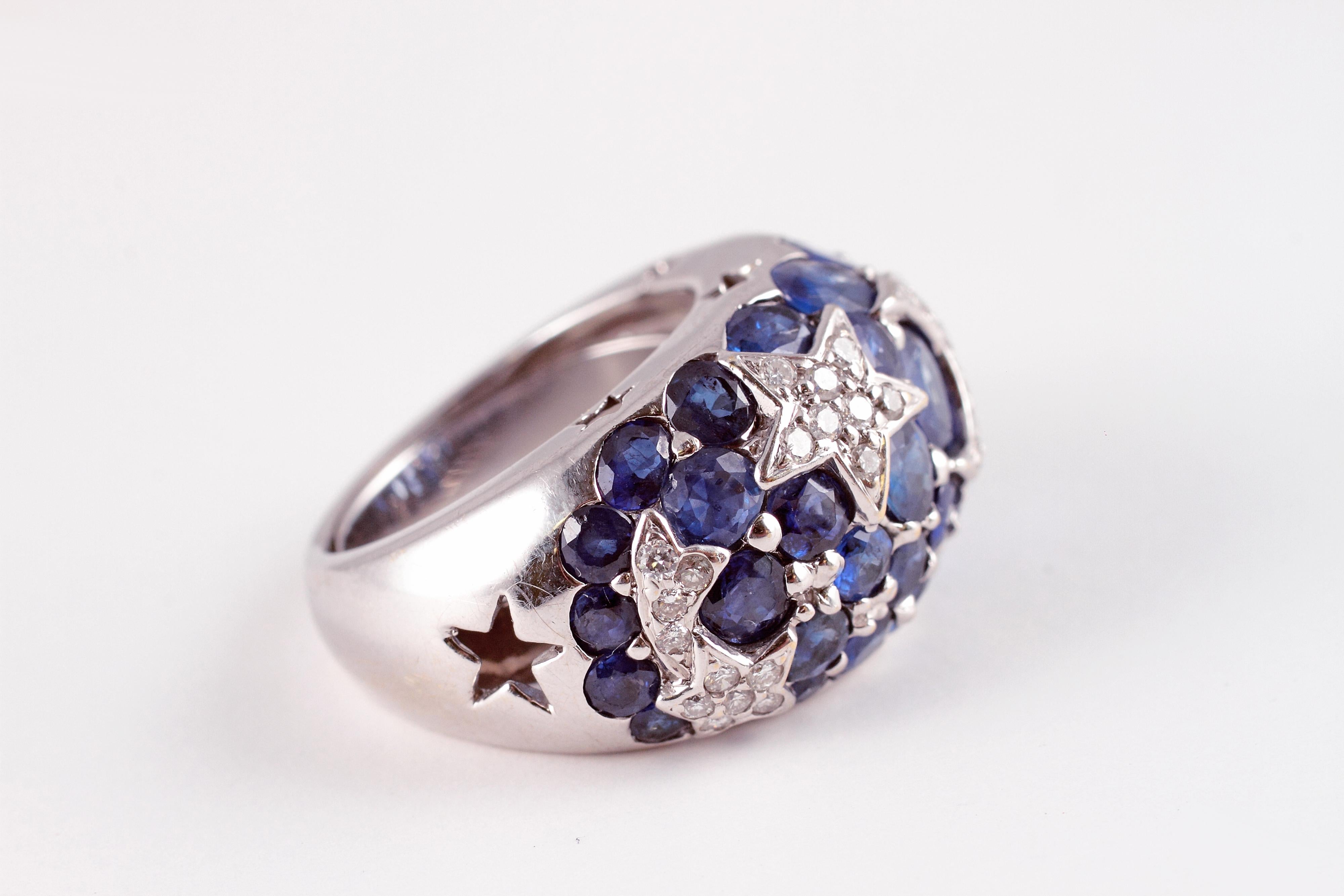 From a Florida estate, this stunning white gold, blue sapphire and diamond ring was purchased from A. B. Levy of Palm Beach and features 0.40 carats of diamonds in the shapes of stars and a crescent moon and over 6.00 carats of blue sapphires.   The