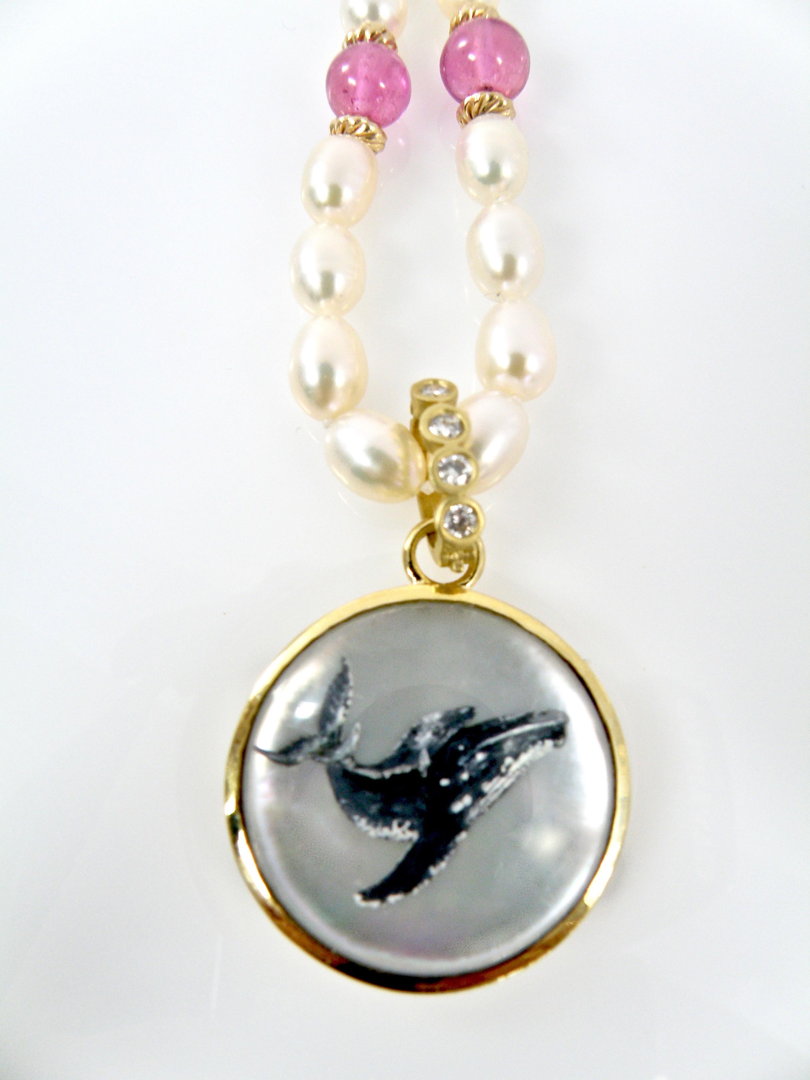 18 Karat  Reverse Crystal Carved Pendant of a Whale Family with a Sapphire bail by Idar Oberstein Carvier