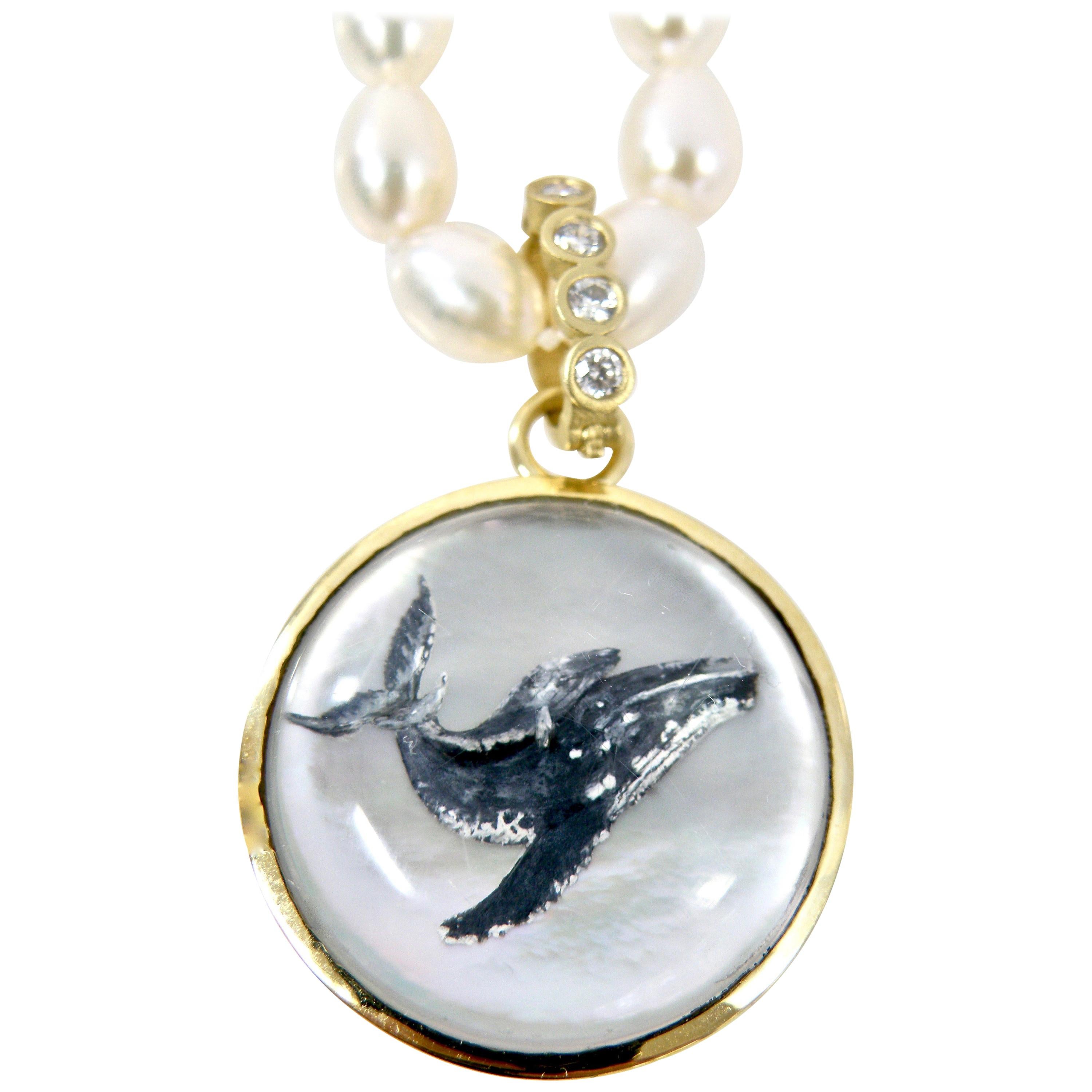 18 Karat Sapphire Reverse Crystal Carving of a Whale Family Pendant in 18 Karat For Sale