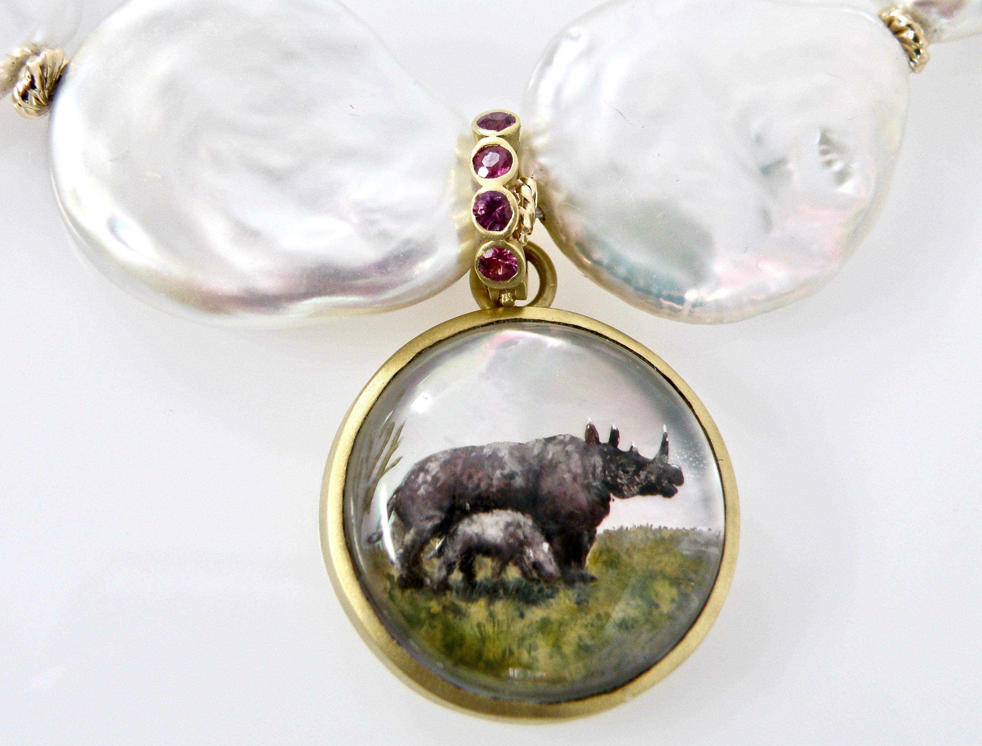 Modern 18 Karat Sapphire Reverse Crystal Carving of Rhinocerous Family Pendant For Sale