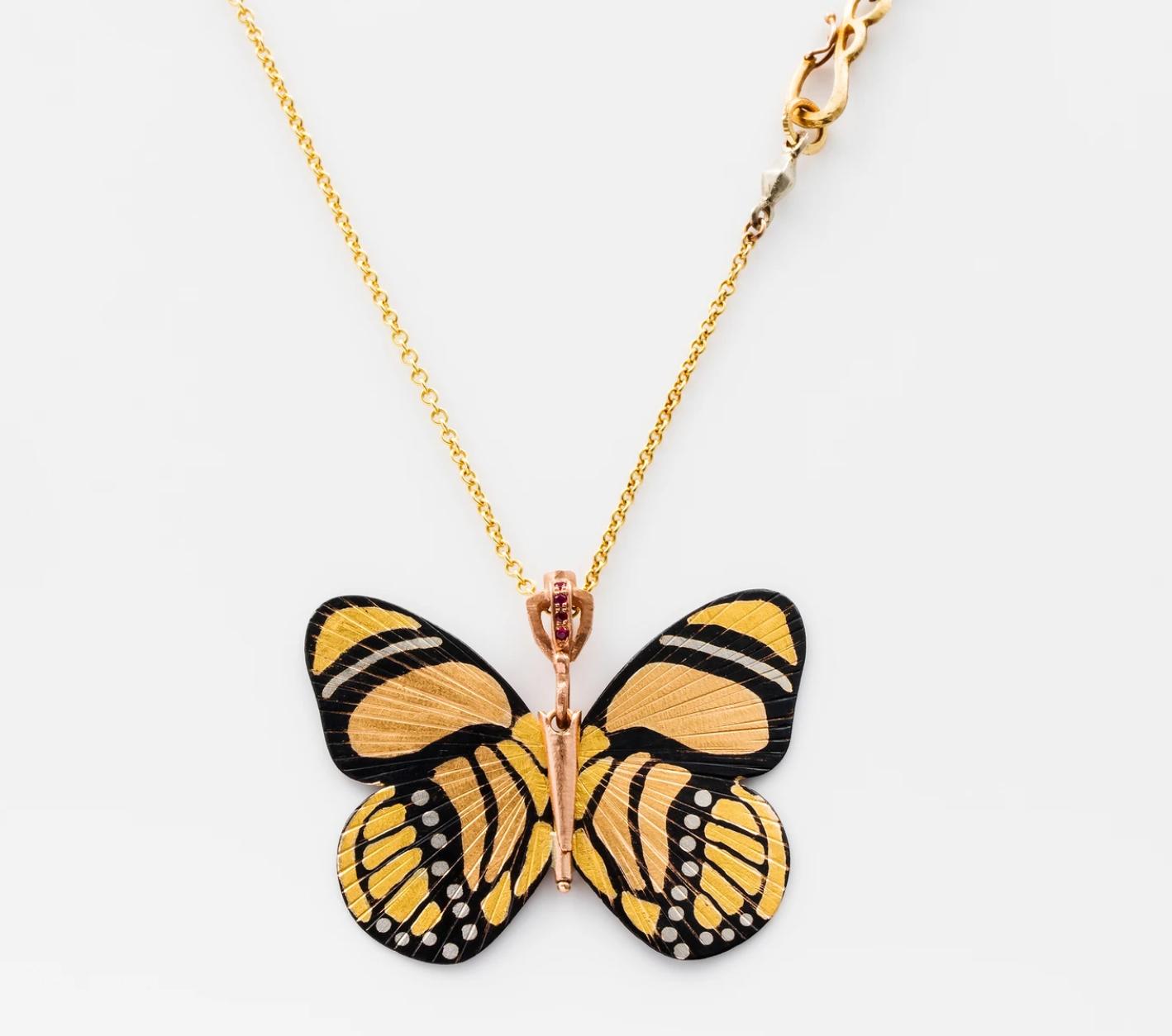 James Banks's signature butterfly necklace features a Large Callicore Butterfly with a hinge at the center to allow movement of the wings, set in 18k Rose Gold, 18k Yellow Gold, 18k White Gold, Shakudo, hung on an 18k Yellow Gold Chain with a secure