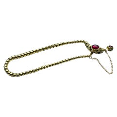 Antique 18 Karat Snake Bracelet with Garnet Head, circa 1860
