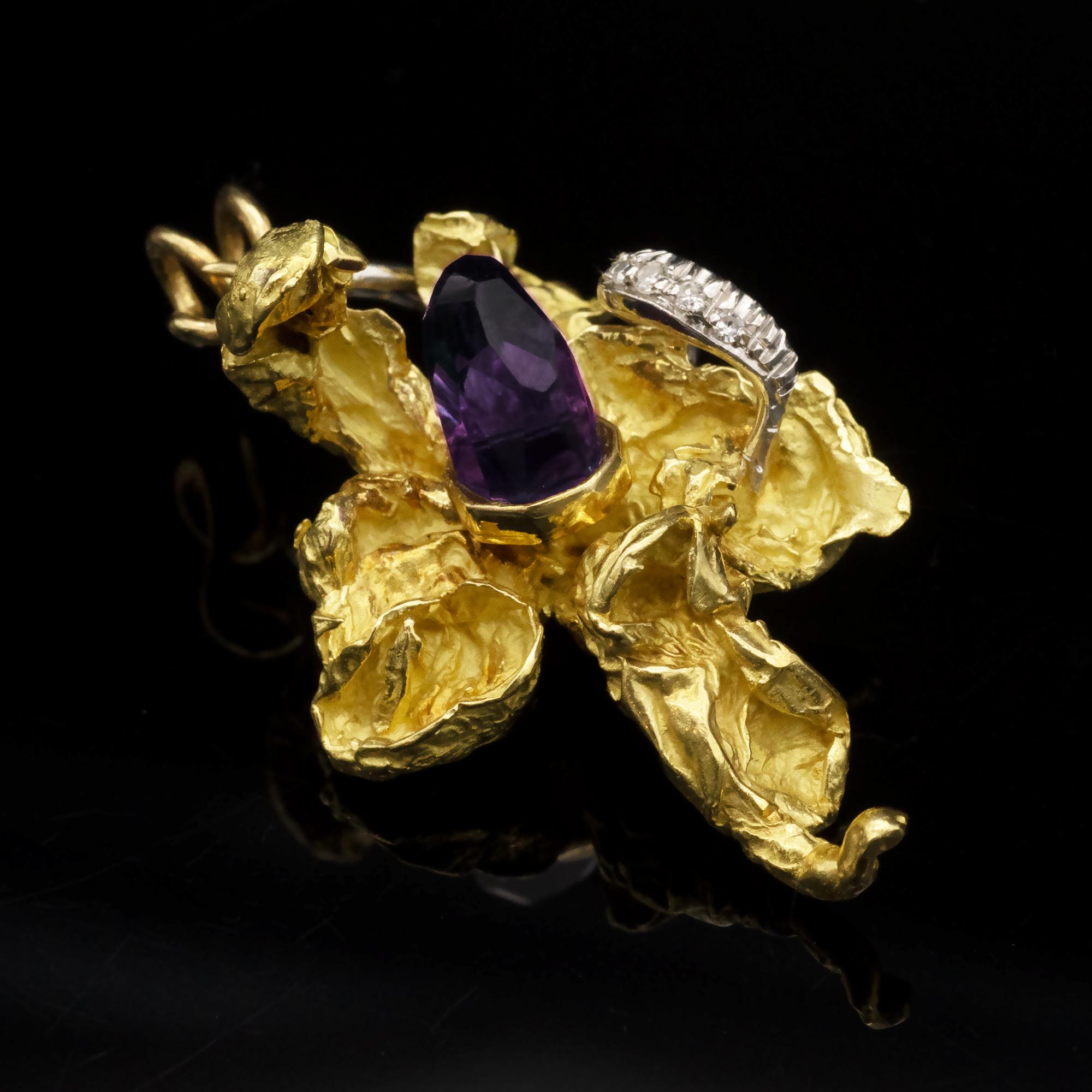 Modernist 18 karat gold Orchid Pendant. The craft reminds of Grima style in solid, nugget like, gold. An Amethyst polished crystal is set in its center while diamond set white gold 