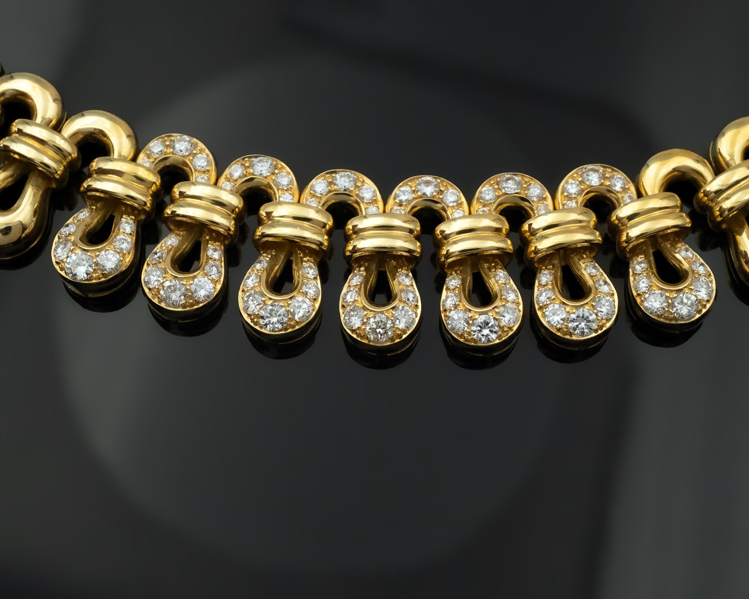 Stylish 18 karat Gold choker necklace set with 2.6 carats of high quality pave set round brilliant cut diamonds ( F-G color, VVS-VS clarity). It is fully articulated and sits perfectly on the neck, the make is excellent.
Length 38 cm
Weight 95.2