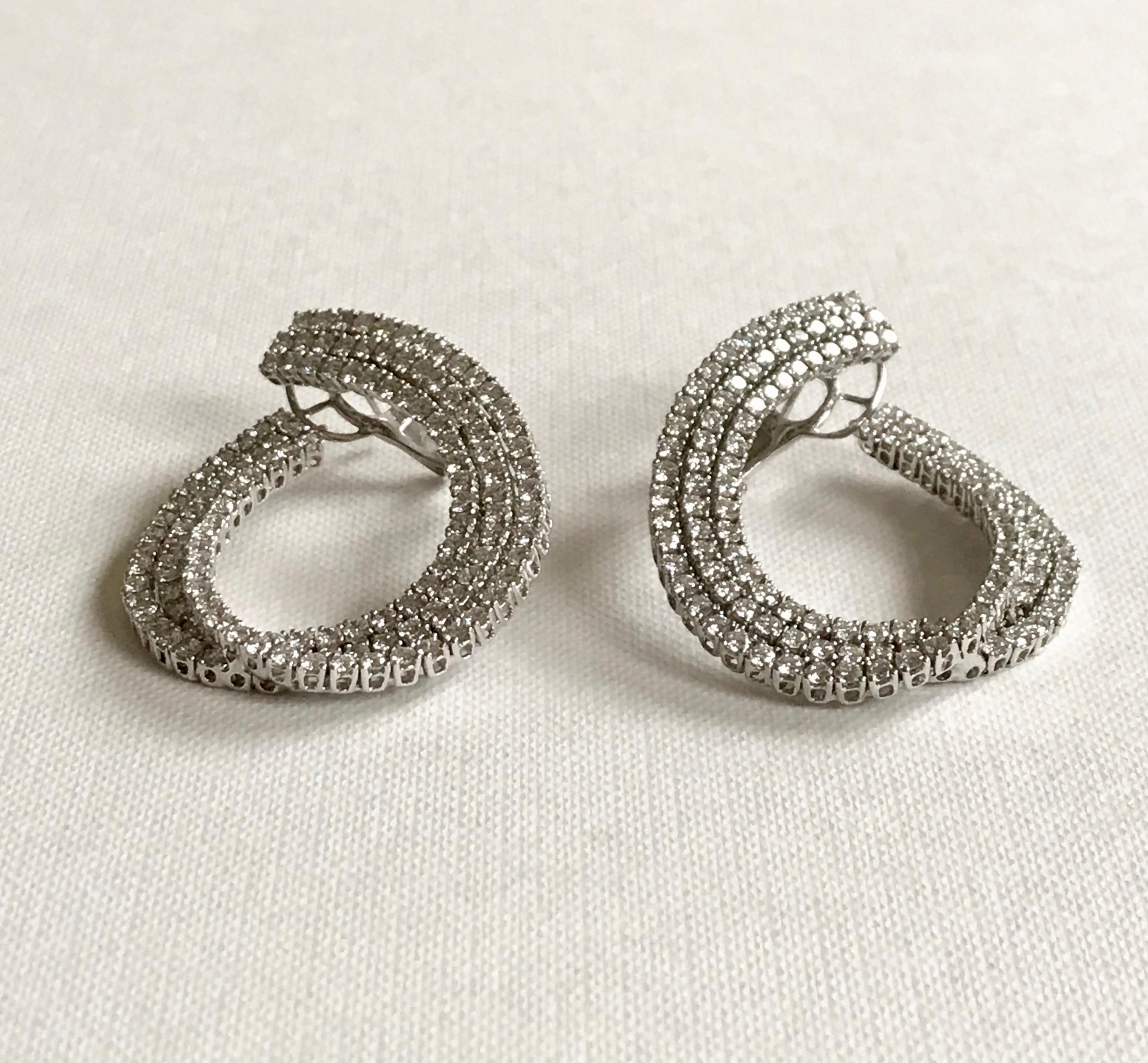 Modern 18 Karat Solid White Gold Diamond Swirl Earrings For Sale
