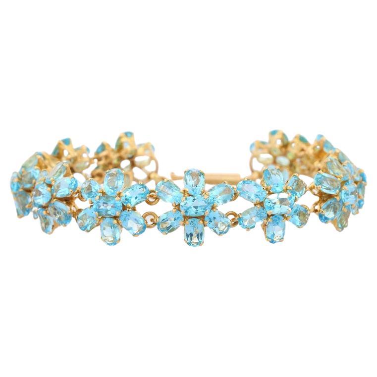 18 Karat massives Gelbgold 38.1 Karat Blauer Topas Floral-Armband