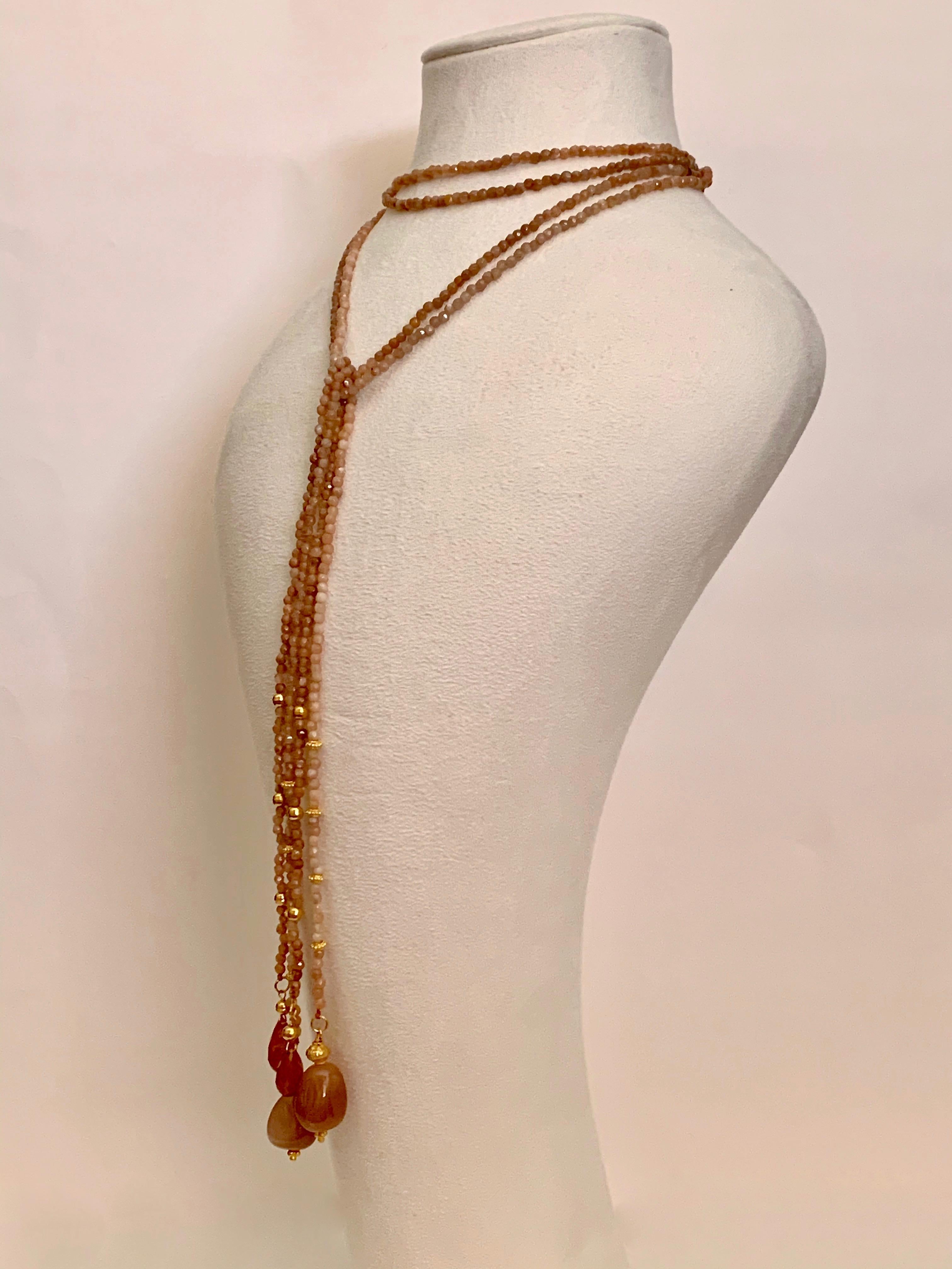 Set of two beaded rope necklaces made of 18 Karat solid yellow gold and untreated moonstones.
The gold has a satin finish.
You can wear this necklace in several ways ( please refer to the photos )
The length of the rope necklaces are 13.00cm and