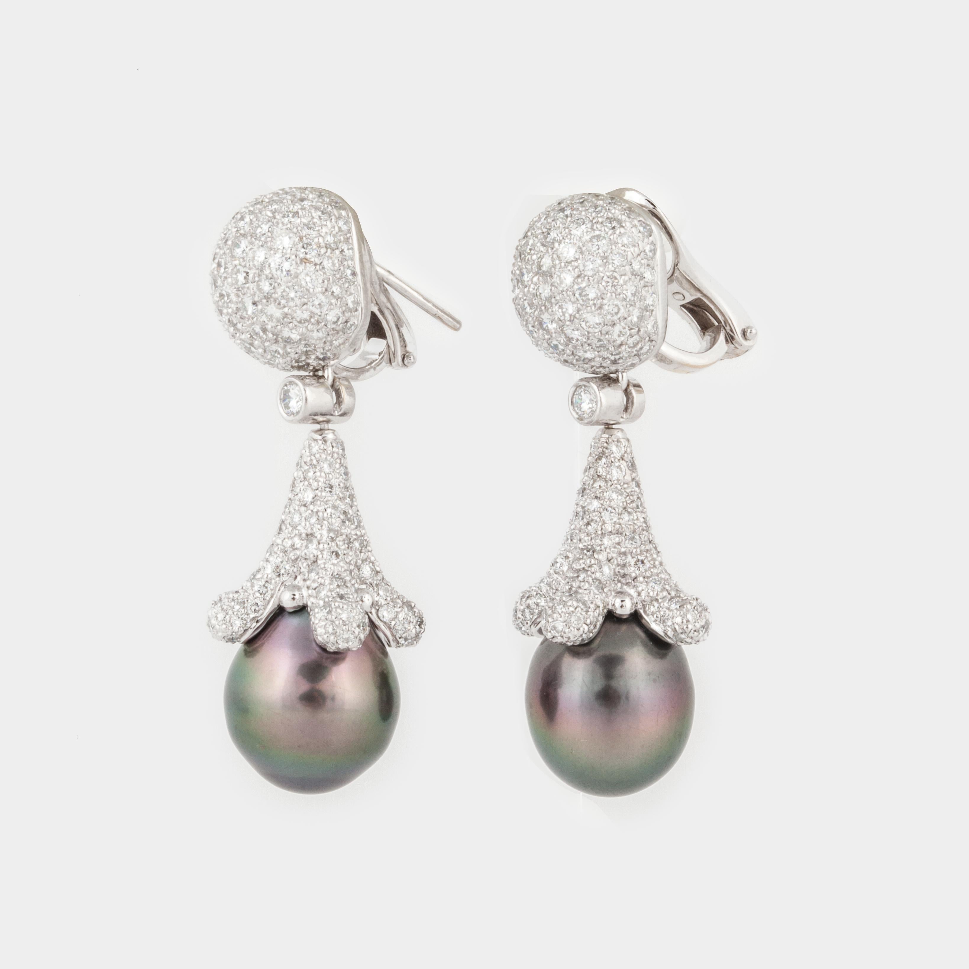 Cultured South Sea gray pearl earrings with diamonds in 18K white gold.  The South Sea pearls measure  11.5mm-14.5mm.  Additionally, there are 406 round diamonds with a total carat weight of 6.10; E-G color and VVS2-VS1 clarity.  The earrings