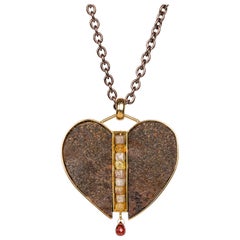 18 Karat Sterling Silver and Rusted Iron Heart Necklace with Garnet and Diamonds