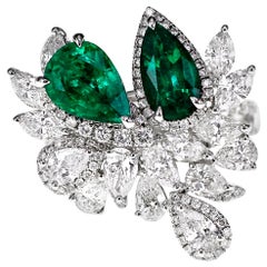 18 Karat Striking Green Natural Emerald and White Diamond Ring