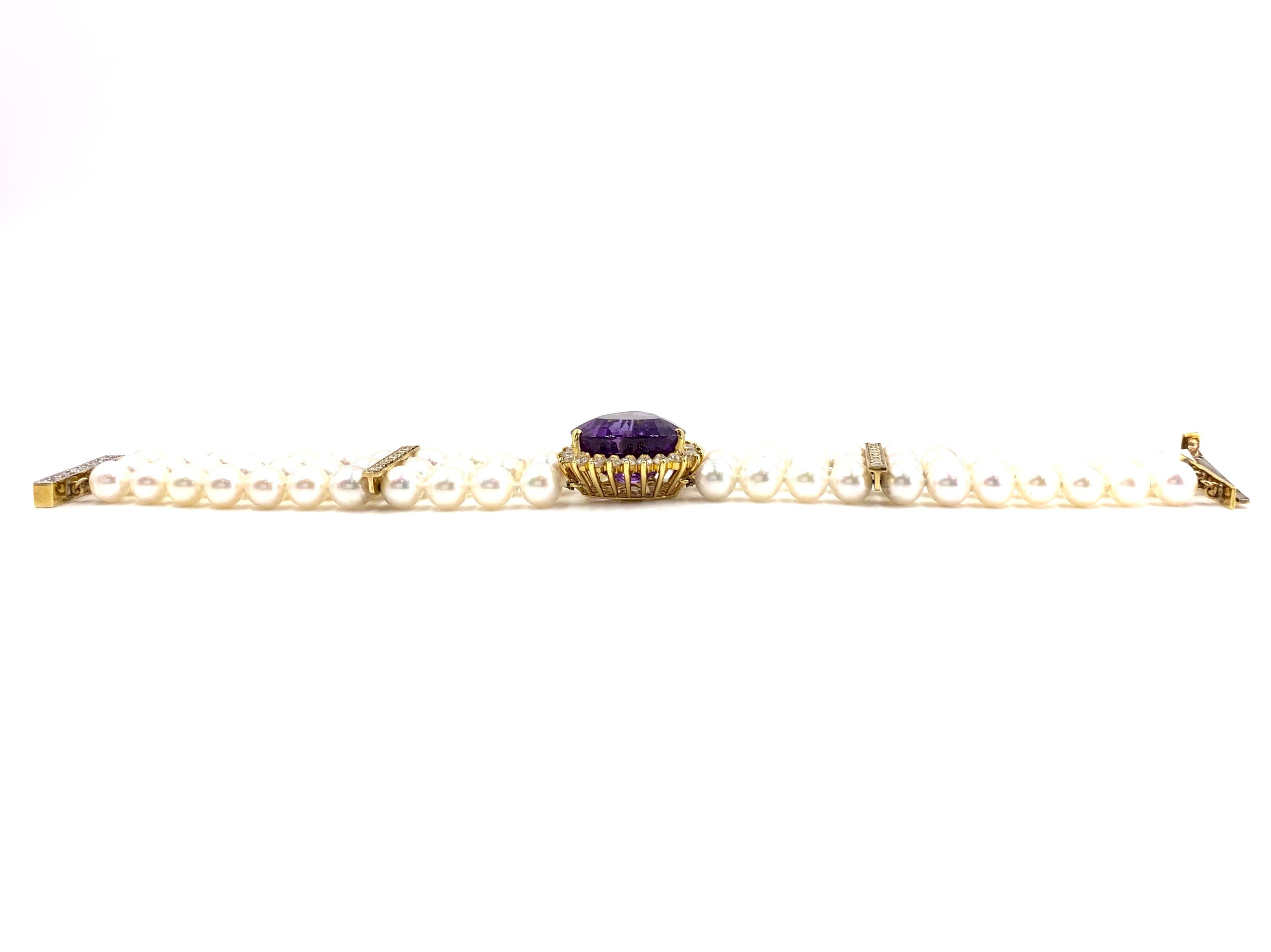 Gorgeous statement three strand cultured pearl bracelet featuring a 21.06 carat pear shaped amethyst and 2.70 carats of white diamonds. Diamonds are approximately G color, VS2 clarity. Amethyst is of fine quality with strong saturation, excellent