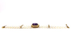 18 Karat Three-Strand Pearl Bracelet with Amethyst and Diamond Center