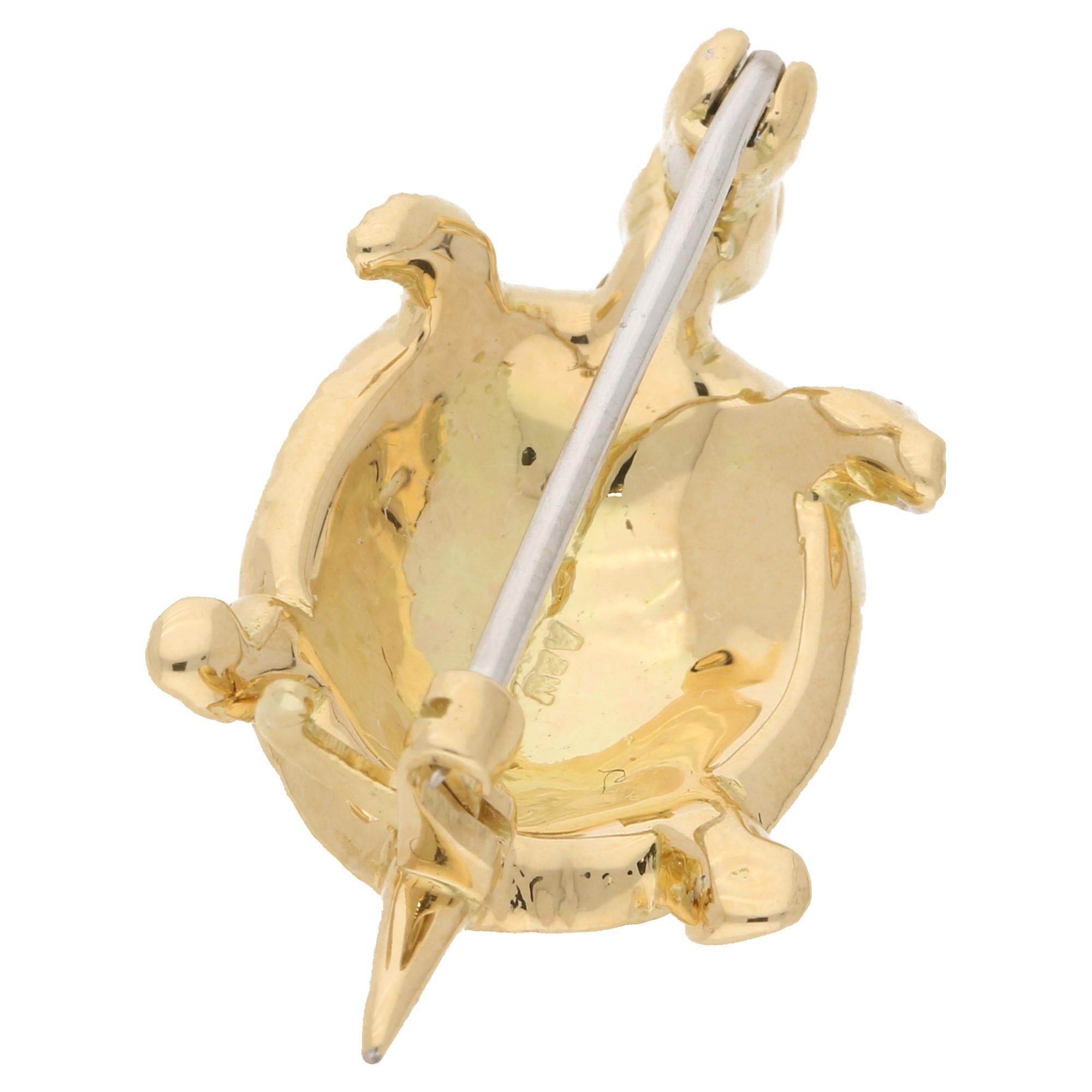 A charming 18ct yellow gold tortoise brooch with six single-cut diamonds emphasizing the head and tail. This brooch has beautiful hand crafted hexagonal detailing to the shell with a secure pin clasp. Stamped 750 for 18ct gold, British maker's marks