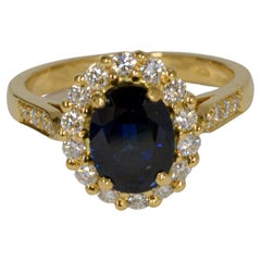 18 Karat Traditional Oval Sapphire and Diamond Cluster Ring