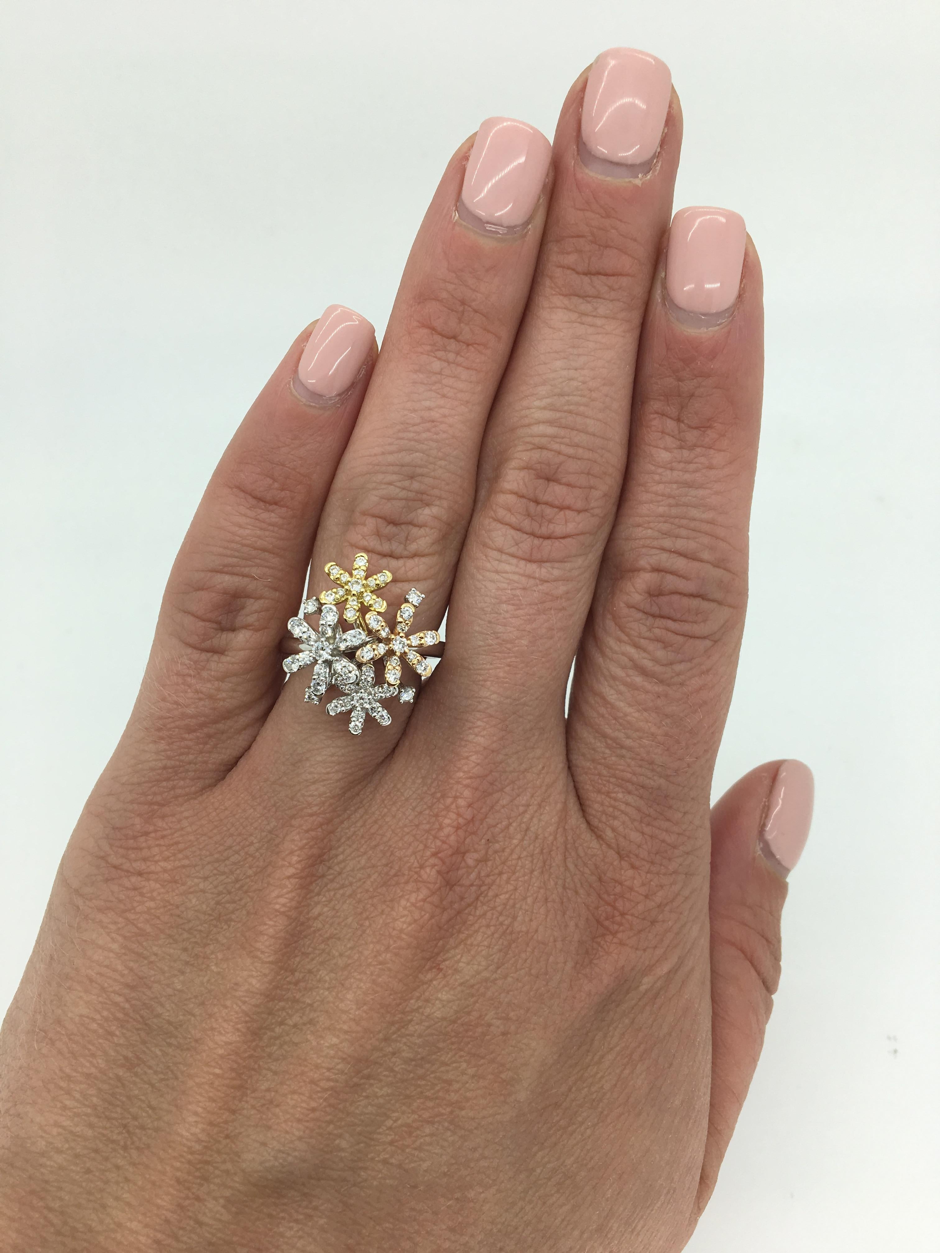 This unique ring is made up of 18K white, yellow and rose gold clusters that are adorned with Round Brilliant Cut Diamonds.

Gemstone: Diamond
Diamond Carat Weight: .61ctw
Diamond Cut: Round Brilliant Cut
Color: G-J
Clarity: Average VS
Metal: 18 Tri