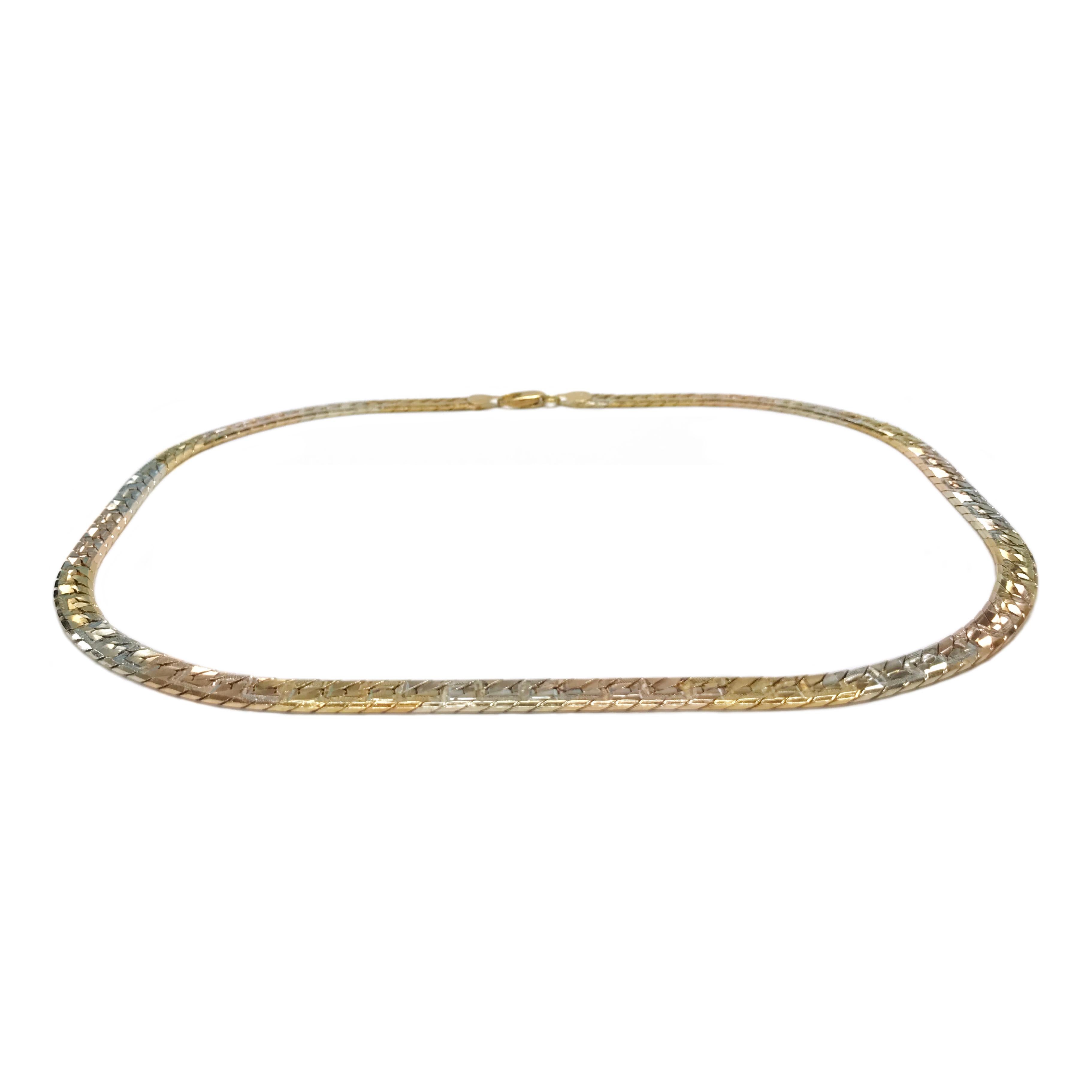 18 Karat Tri-Colored Gold Italian Chain Necklace. This bold chain alternates gold colors between yellow, rose, and white gold throughout the entire length of the necklace. The width of the necklace is 0.25