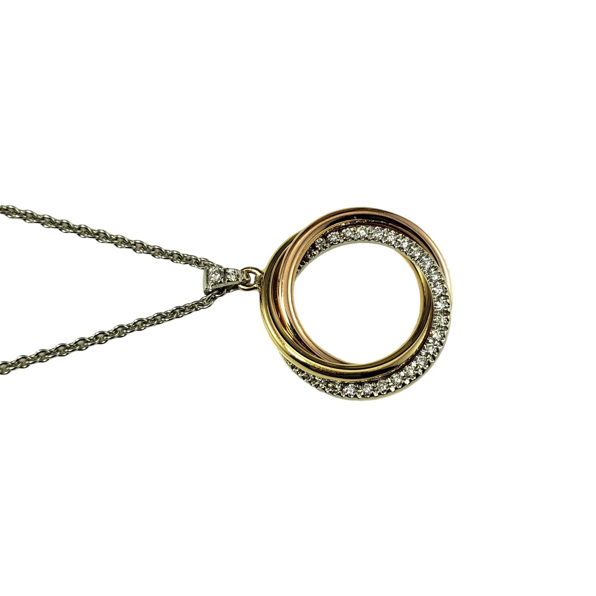 Vintage 18 Karat Tricolor Gold Diamond Pendant Necklace-

This lovely triple ring pendant features 27 round brilliant cut diamonds set in 18K rose, white and yellow gold.  Suspends from a classic white gold cable necklace.

Approximate total diamond