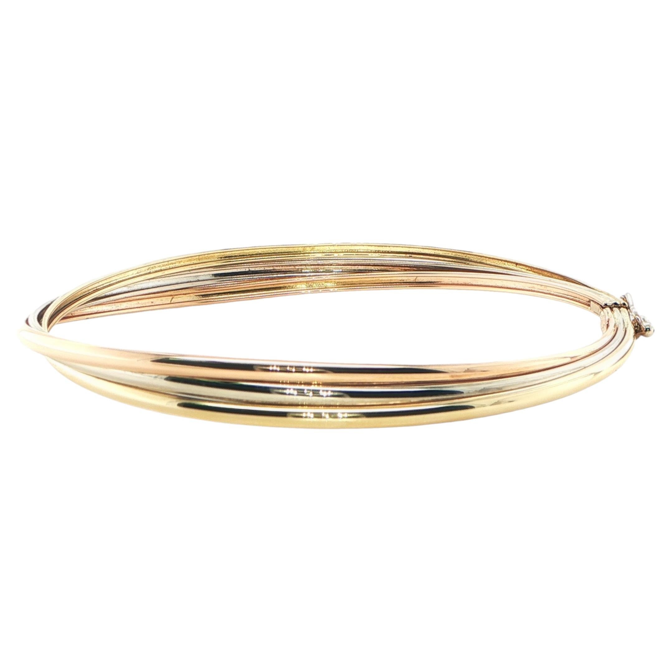 18 karat tricolor gold twist bangle