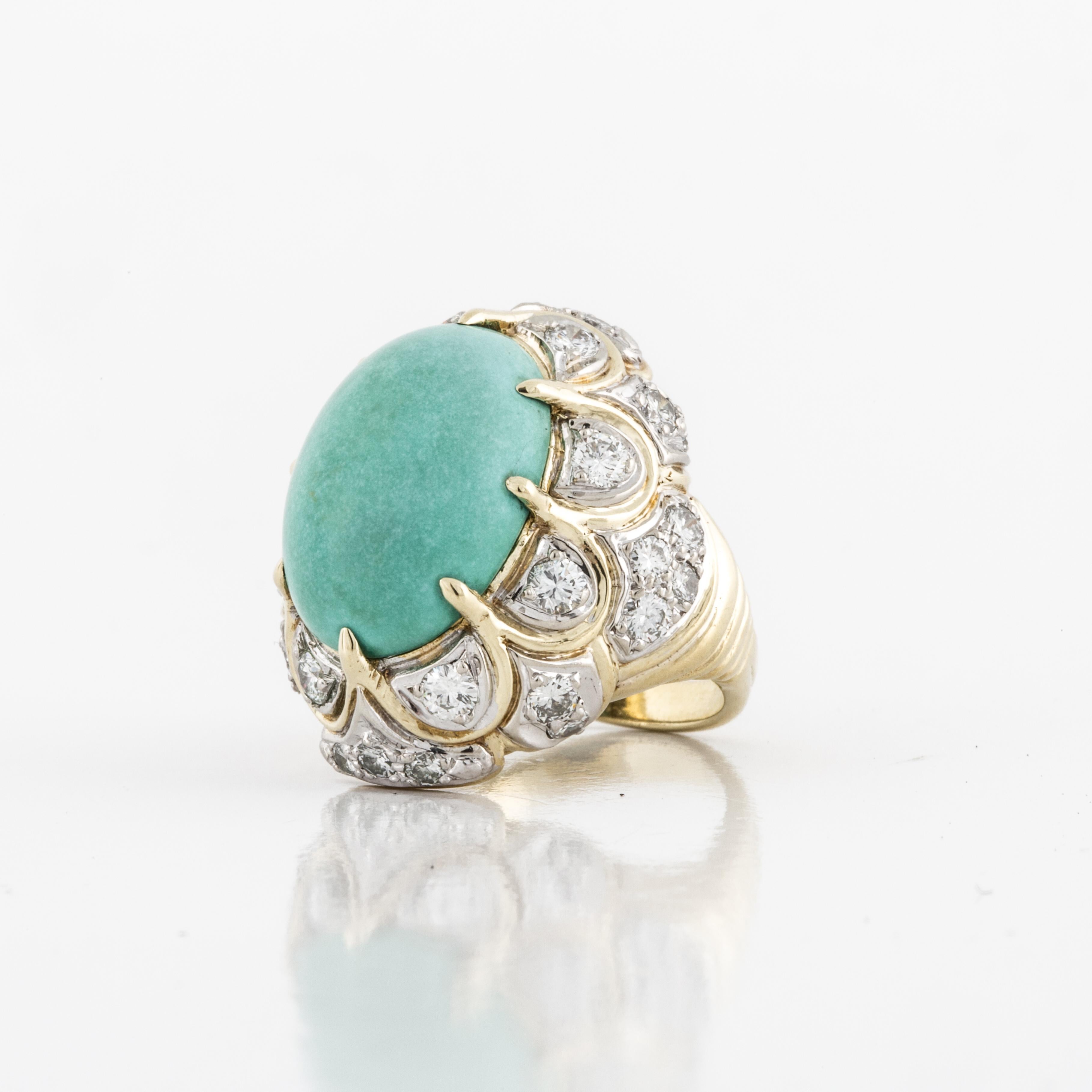 18K yellow gold ring featuring a turquoise stone accented with diamonds that are set in white gold.  There are 30 round brilliant-cut diamonds with a total carat weight of 2.10; G-H color and VS clarity.  Ring is currently a size 6 1/4. 