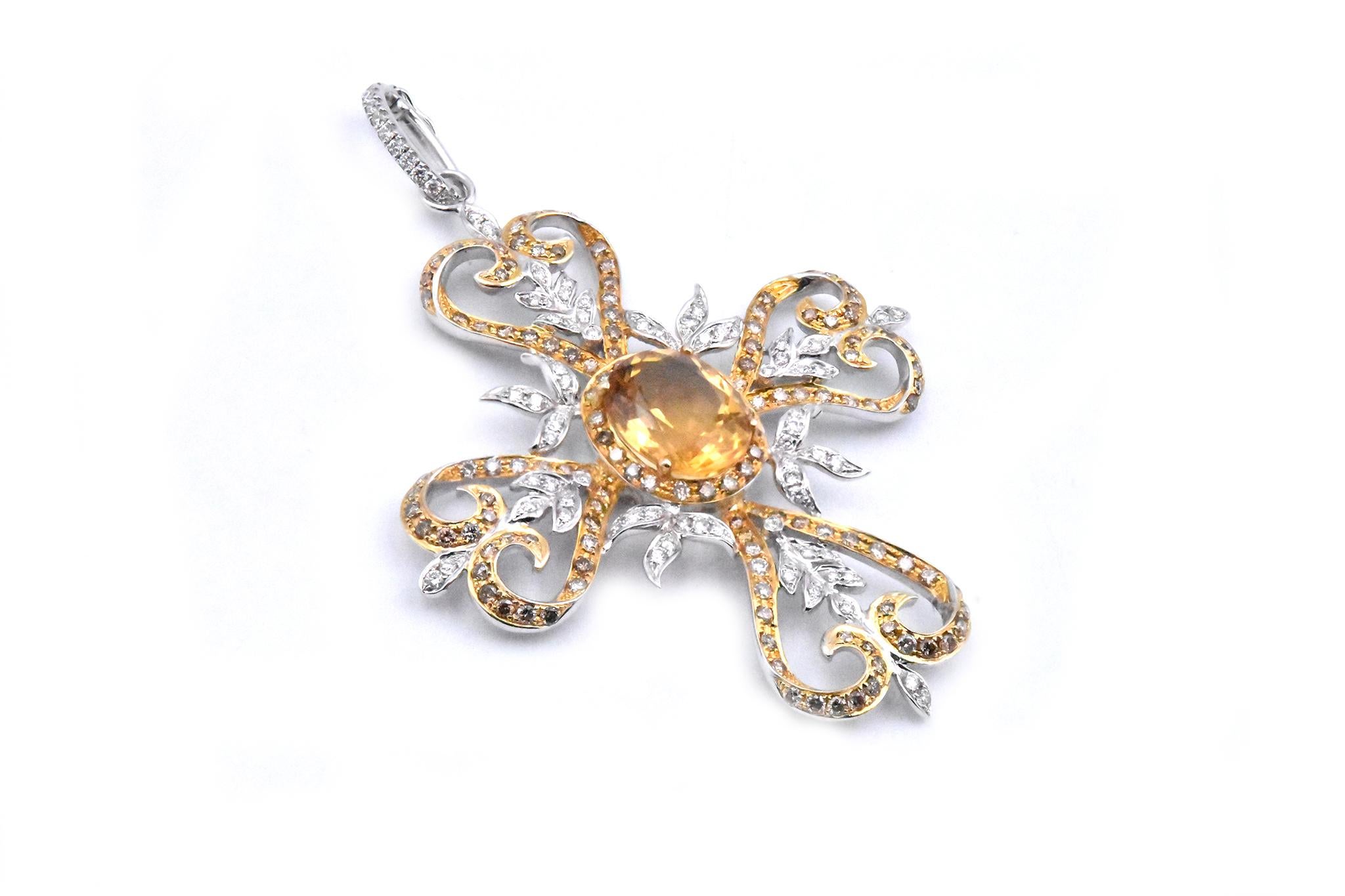 Designer: custom
Material: 18K yellow and white gold
Diamonds: 138 round cut = 1.89cttw
Color: champagne
Diamond: 74 round cut = .61cttw 
Color: G
Clarity:  SI1
Dimensions: the pendant measures 71.75 X 49.15 mm
Weight: 13.69 grams
