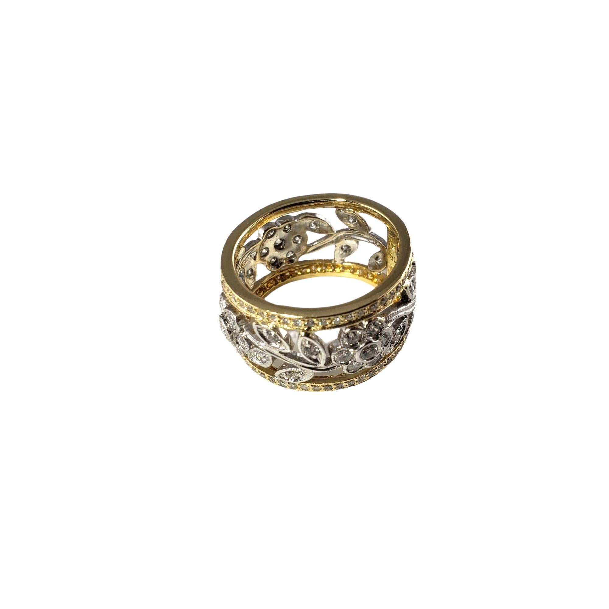 Vintage 18 Karat Two Tone Gold and Diamond Floral Band Ring Size 6.75-

This lovely 18K yellow and white gold ring features 133 round brilliant cut diamonds set in a stunning floral design.  Width:  12 mm.

Approximate total diamond weight:  2.0