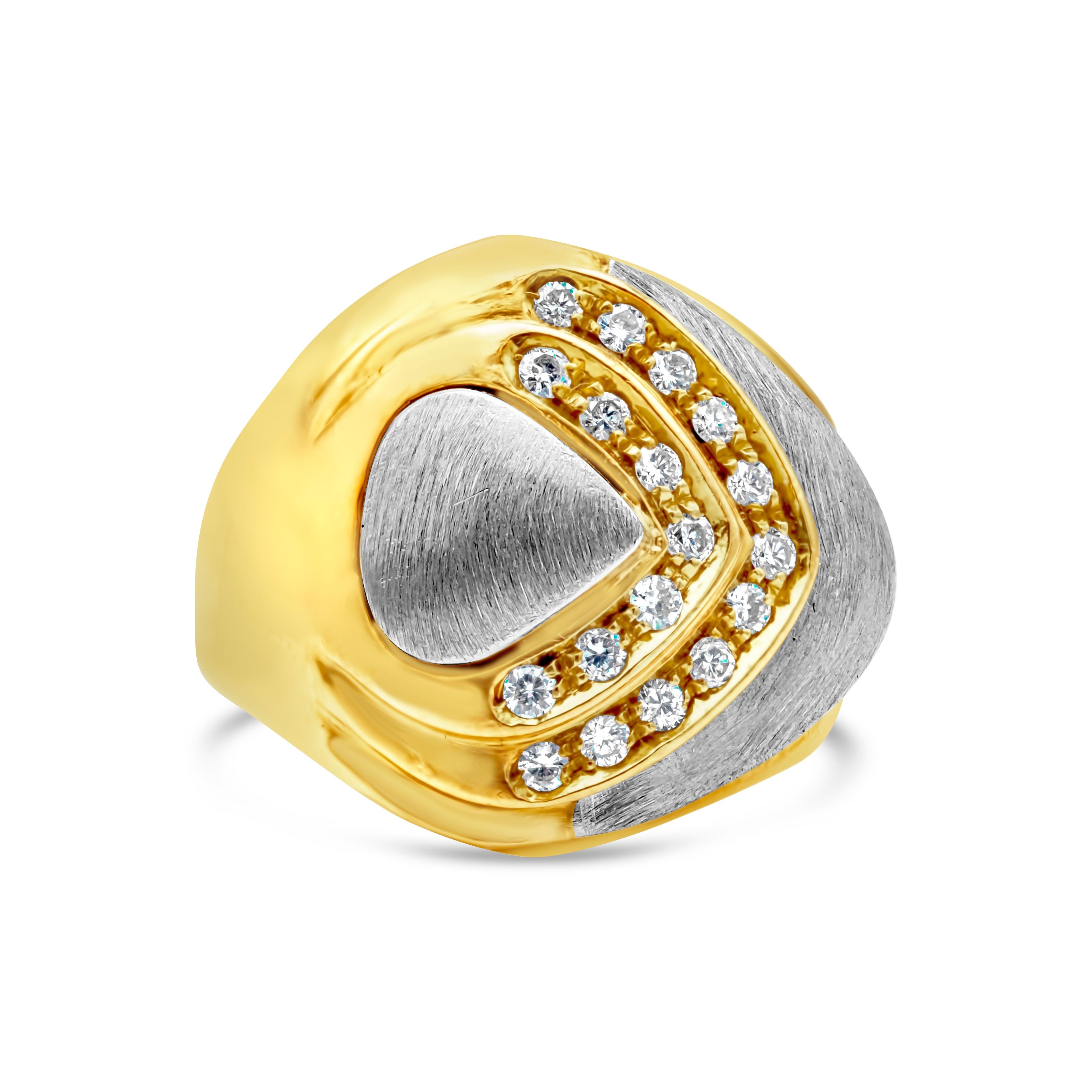 A fashionable vintage ring showcasing round brilliant diamonds weighing 0.27 carats total, set in an 18 karat domed yellow gold setting accented with brushed white gold design. Size 6.75 US.


