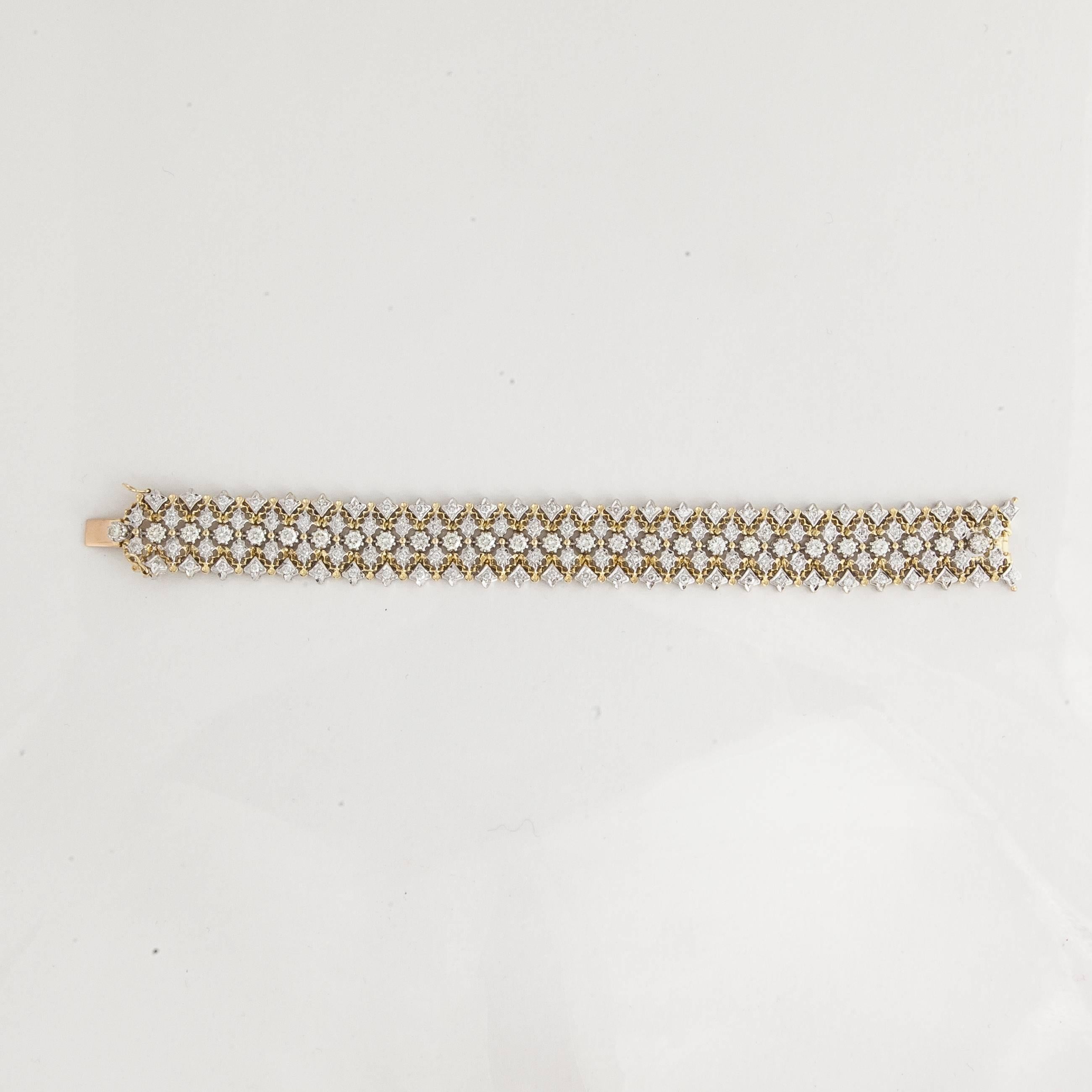 This white and yellow gold bracelet features 135 round diamonds totaling 6.5 carats.  The diamonds are G-I in color and SI in clarity.  Measures 7