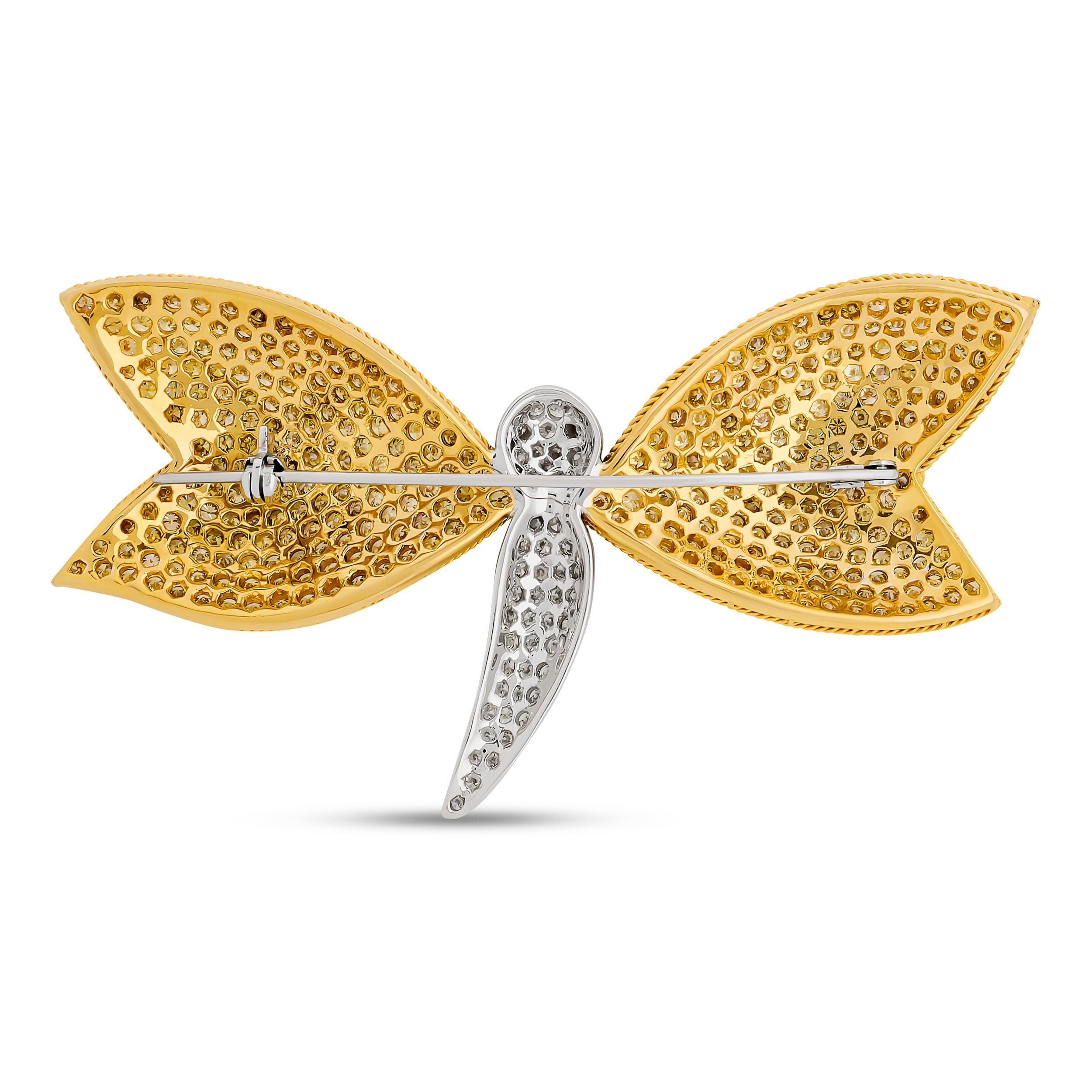 This striking dragonfly pin features a body of pavé-set white diamonds, with its four detailed wings brilliantly encrusted with pavé-set yellow diamonds.

There are about 320 round yellow diamonds that weigh approximately 9.76 carats. There are also