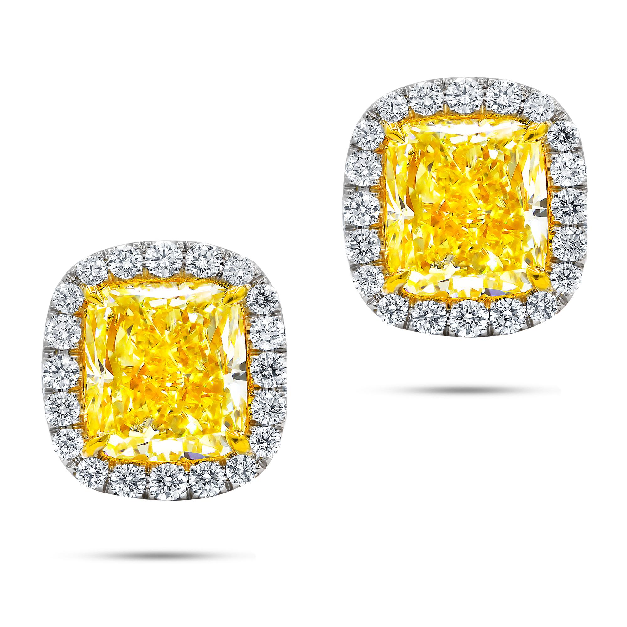 18 Karat Two Tone Stud Earrings Feature Gia Certified Cushion Cuts 1.52cts Fcy/vs1  And 1.51cts Fcy/vvs12 Set With 0.40 Cts White Diamonds On The Side.
