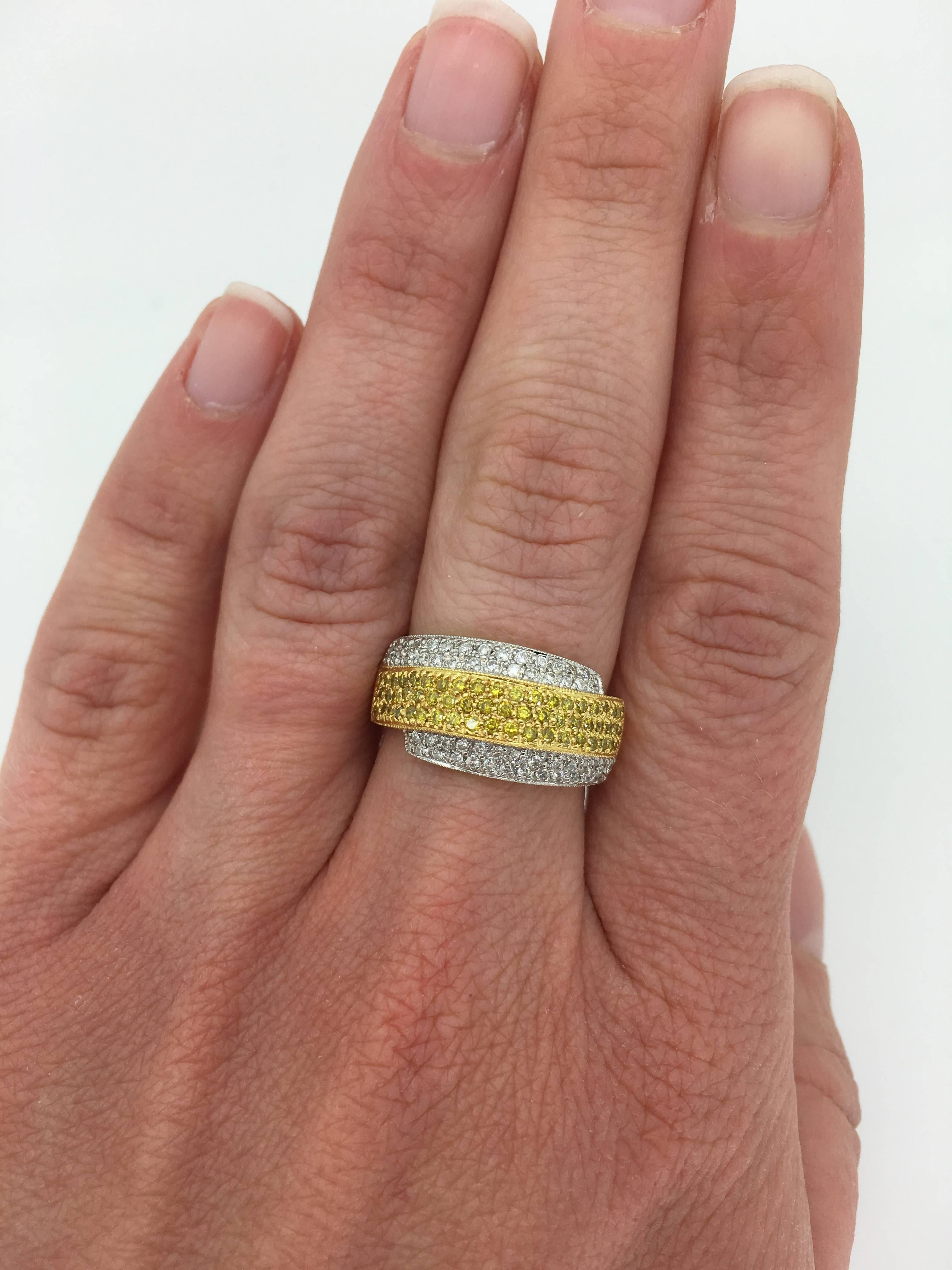 Unique 18k two-tone diamond ring featuring white and yellow diamonds. 

This Unique Two Tone Diamond Ring Is Adorned with Yellow and White Diamonds Set in a Two Tone 18K Gold.

Diamond Carat Weight: Approximately 1.10CTW
Diamond Cut: 113 Round