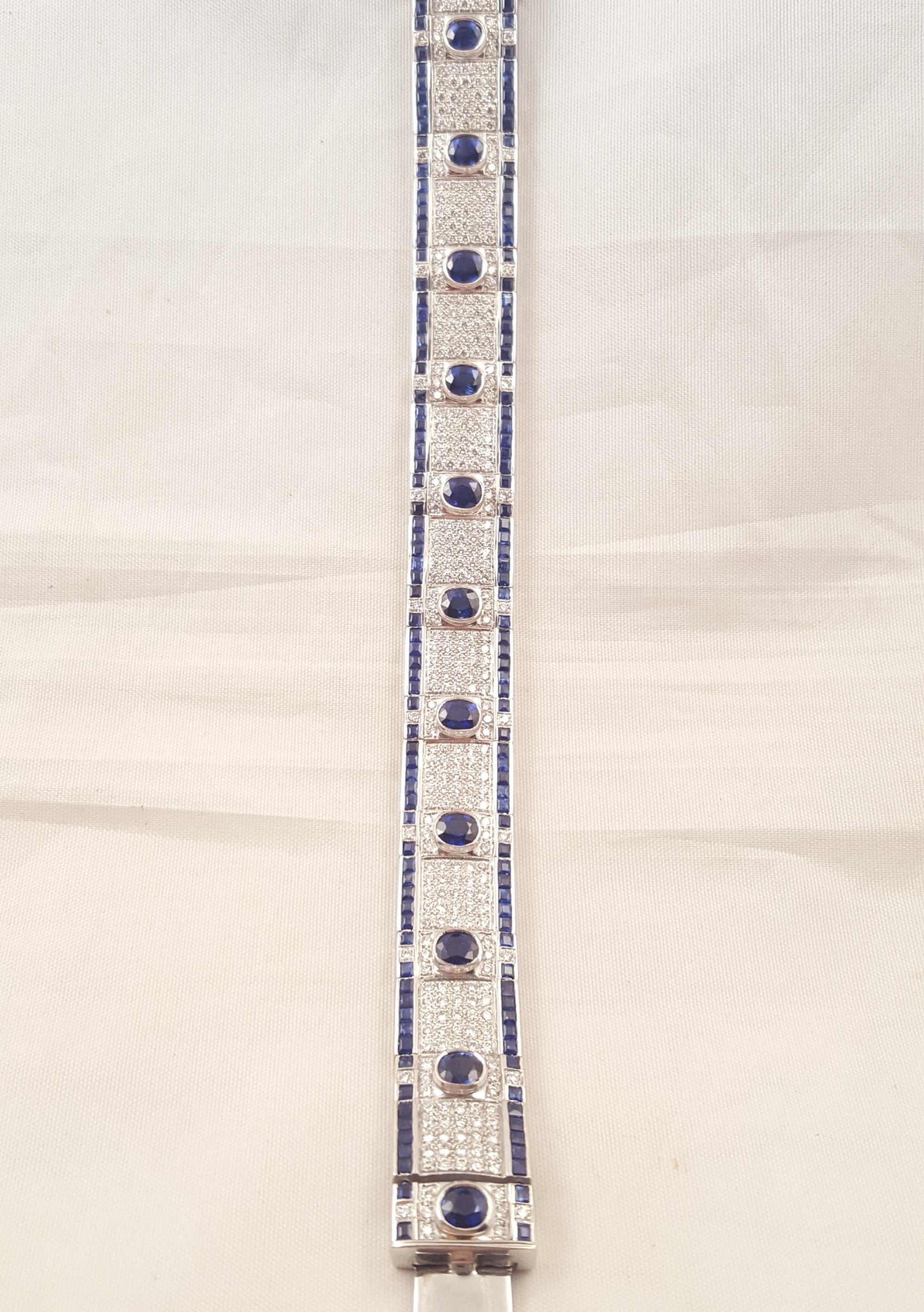 Perhaps the most stunning 18 karat Ceylon Sapphire and Diamond bracelet we have seen!  Perfectly matched faceted oval sapphires are bezel set on white diamond pave links.  Princess cut Ceylon sapphires are channel set on each side of the bracelet. 