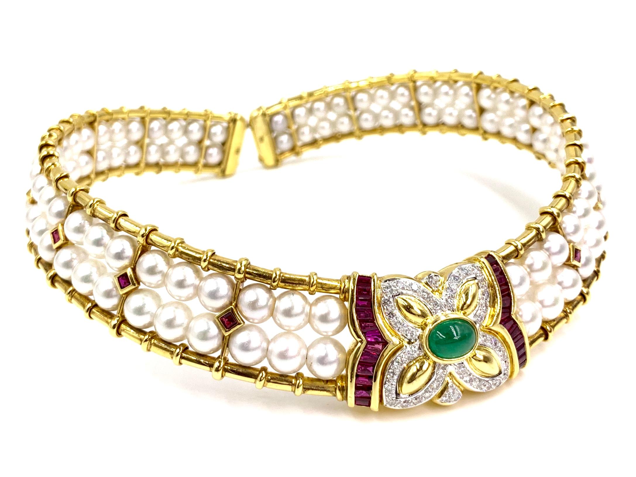 Very well made flexible 18 karat yellow gold Victorian inspired choker necklace featuring two rows of lustrous 6.5mm natural pearls, a cabochon emerald, rubies and white diamonds. Vivid green cabochon emerald weighs 1.36 carats. 30 rubies have a