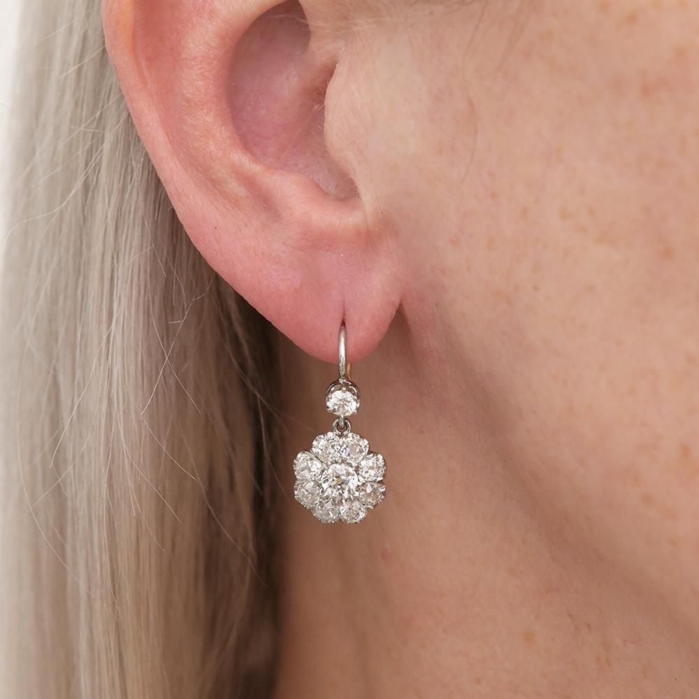 A stunning pair of antique 18k gold Victorian Old European Cut Diamond (est. 2.10 each) earrings, comprising 1 x 0.33ct with 9 x 0.20ct claw set diamonds to each cluster set in a pierced gallery. The total diamond weight is est. 4.20cts. In an 18k