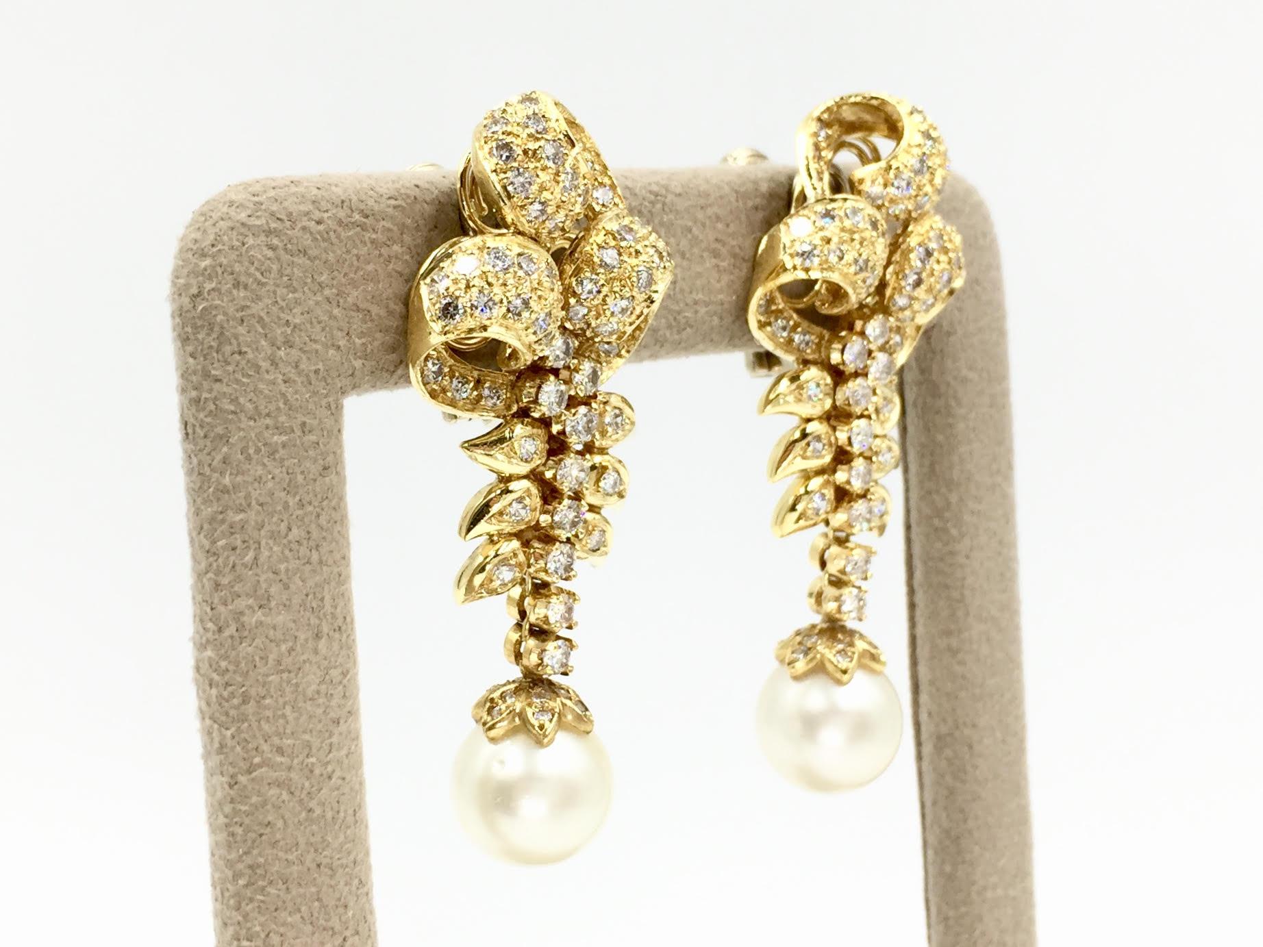 Elegant Edwardian inspired Italian made 18 karat yellow gold drop earrings featuring 3.14 carats of high quality round brilliant diamonds, approximately E-F color, VS2 clarity. An 11mm ivory cultured pearl dangles beautifully at the end of each