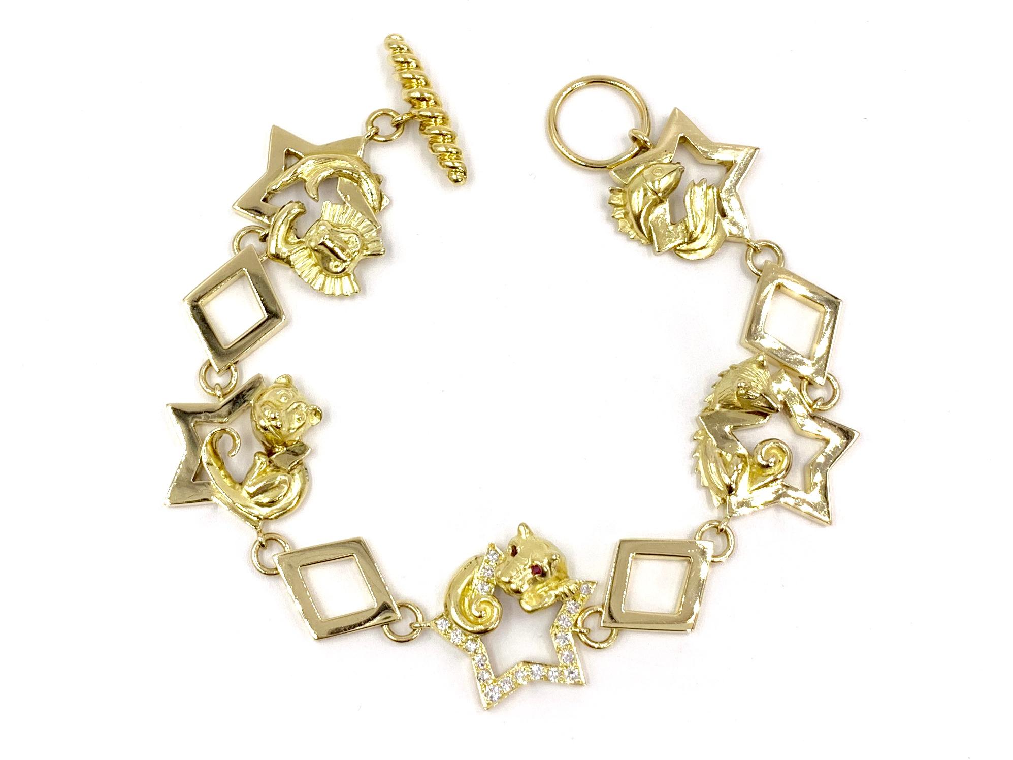 Created by expert jeweler Charles Turi. This vintage 18 karat yellow gold charm style bracelet with square and star links feature five different animals, including a panther adorned with ruby eyes. The panther rests upon a center star that is set
