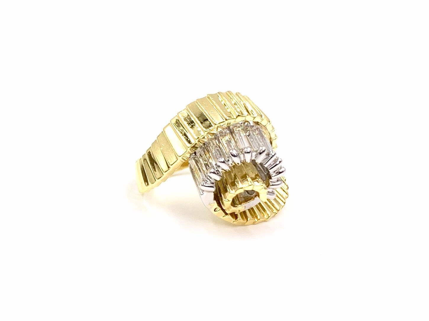 Made with superior quality by Jose Hess in 18 karat yellow and white gold. This uniquely designed modern swirl ring features 2.10 carats of high quality baguette cut diamonds, perfectly prong set in white gold for an extra bright look. Diamonds are