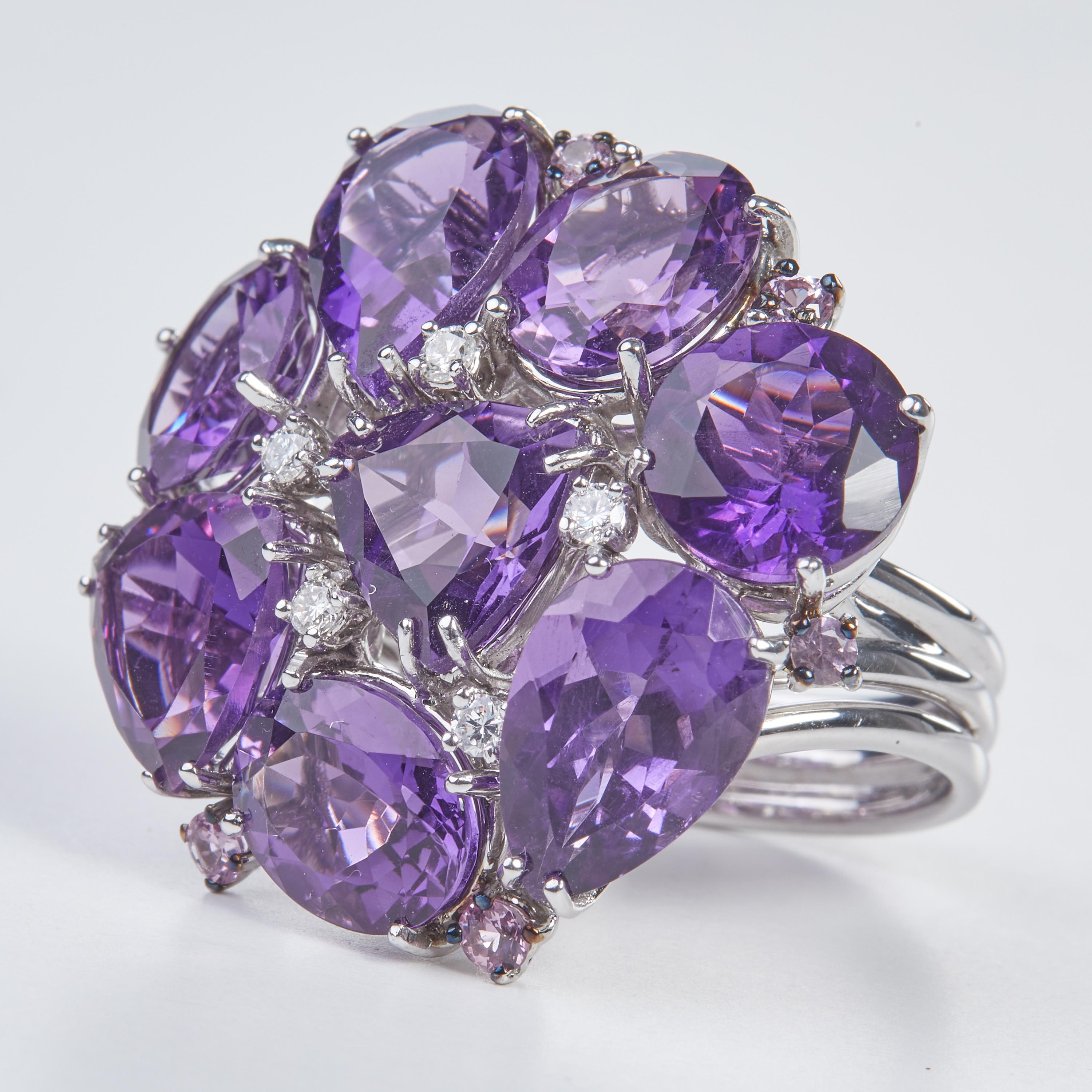 18 Karat WG Diamond and Amethyst Coktail Ring
5  Diamonds 0,18 Carat
8 Amethist  19.47 Carat
7 Sap. pink 0.63 Carat

Founded in 1974, Gianni Lazzaro is a family-owned jewelery company based out of Düsseldorf, Germany.
Although rooted in Germany,