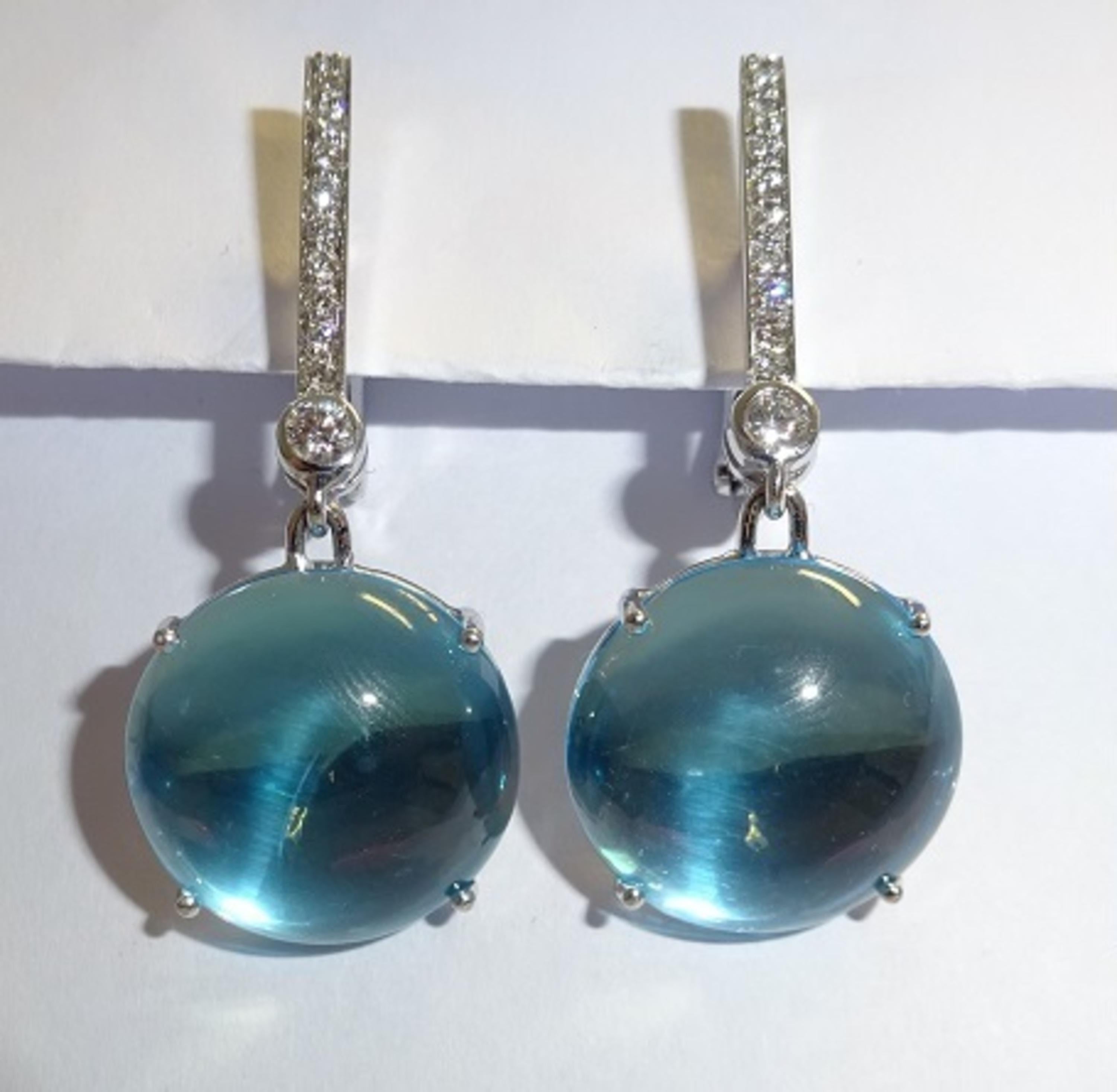 18 Karat WG Diamond, and Topaz  Dangle Earrings

20 Diamonds  0,24 Carat H SI
2 Topaz 19,20 Carat


Founded in 1974, Gianni Lazzaro is a family-owned jewelry company based out of Düsseldorf, Germany.
Although rooted in Germany, Gianni Lazzaro's