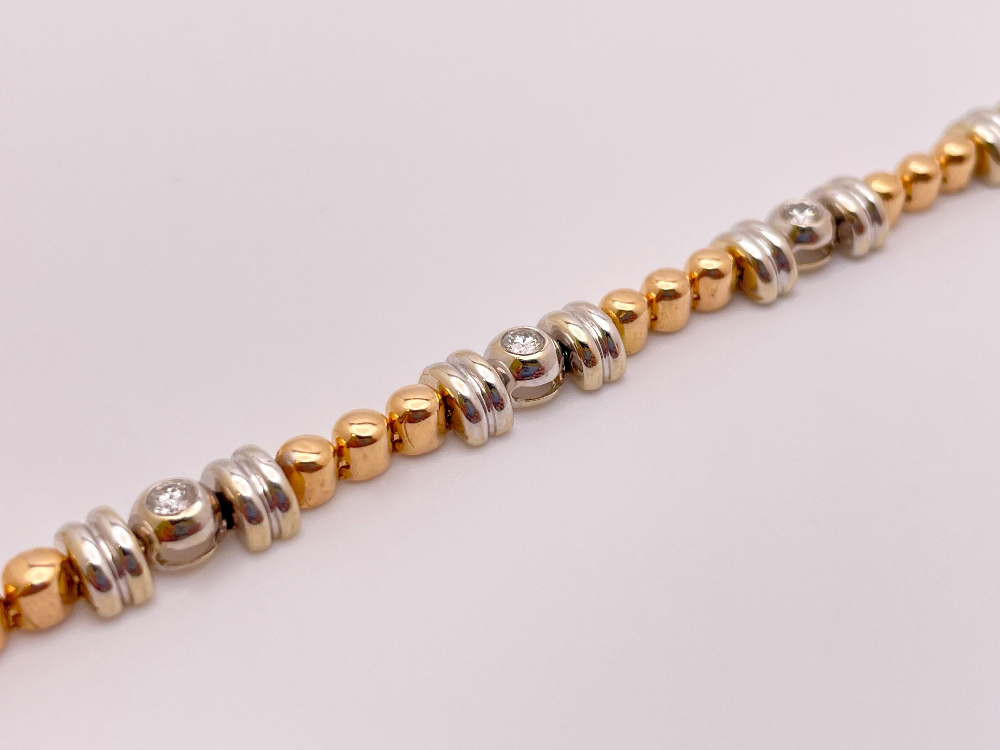 An original 18K (Karat) white and rose gold diamond link bracelet. Mounted with eight diamonds weighing a total of approximately 1.00 CT (Carat), H-J color, SI1-SI2 clarity. Accompanied by a safety clasp, this magnificent bracelet features a unique