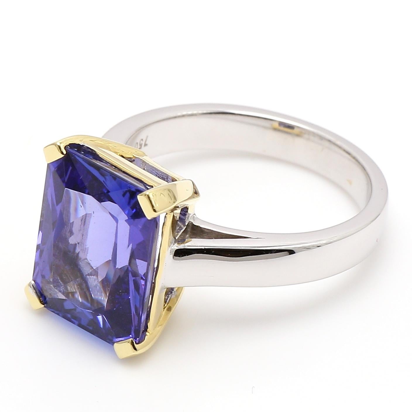 Handcrafted 18 Karat White and Yellow Gold Solitaire Cocktail Ring.
Radiant Cut Tanzanite 6.82ct  VAAA color, VVS clarity.
Graded by Ayanda Tanzanite inline with International Tanzanite Grading
Size 6 3/4 USA, the ring can be sized two sizes up and