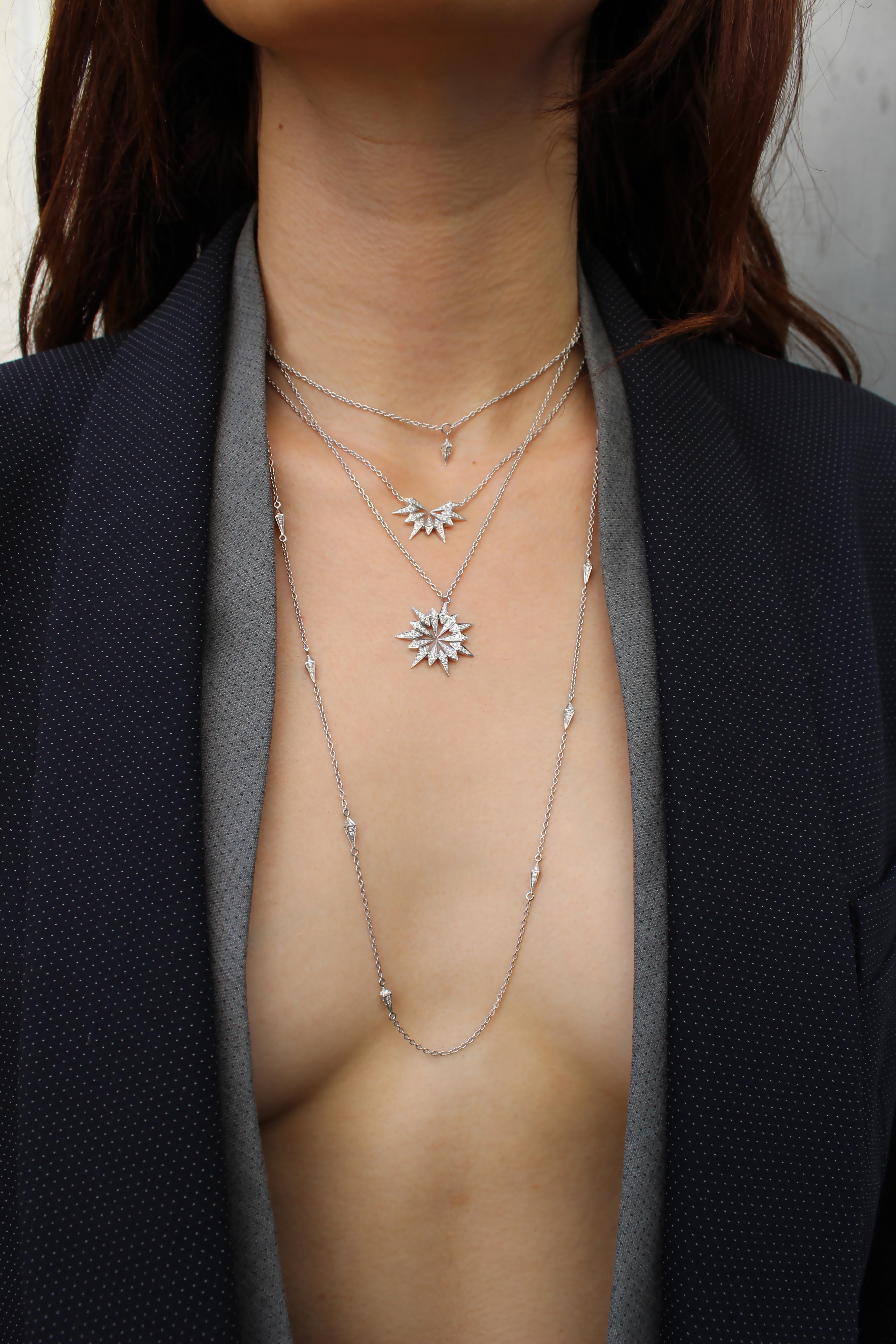 18k White Gold Diamond Starburst Pendant Necklace features a spike edge white diamond pave starburst pendant set in 18k White Gold on an 18k White Gold Chain
Includes lobster closure clasp at back of the neck

18k White Gold : 5.84g
White Diamonds :