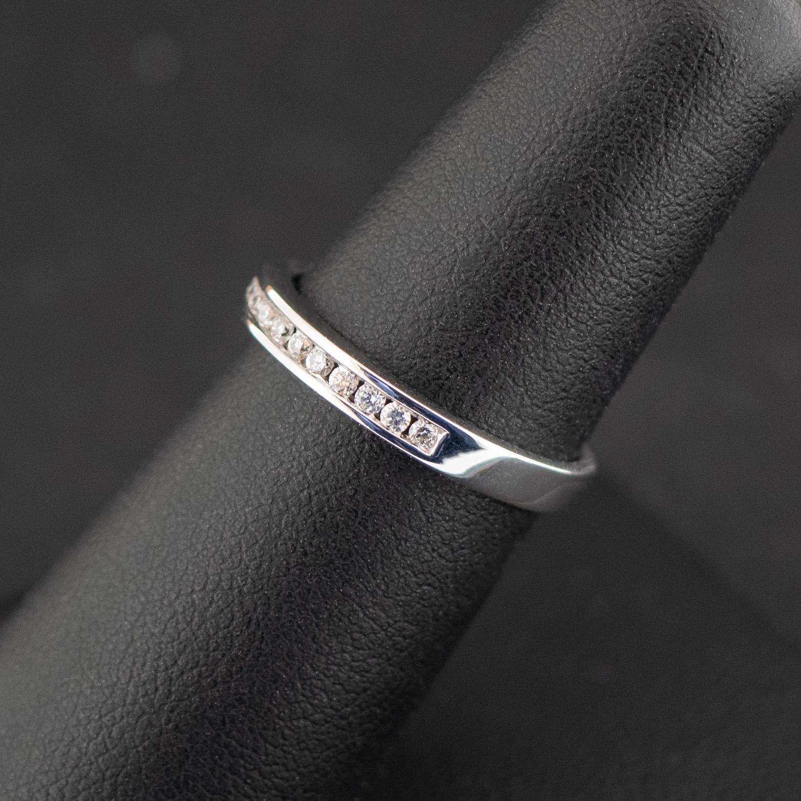 Condition: New
Material: White Gold
Purity: 18ct
Main Stone Identity: Diamond
Main Stone Total Carat Weight: 0.18ct 
Type: Half Eternity
Size: M
Weight: 2.46gms

Gemstones : All size, weights and stone qualities are taken from the included