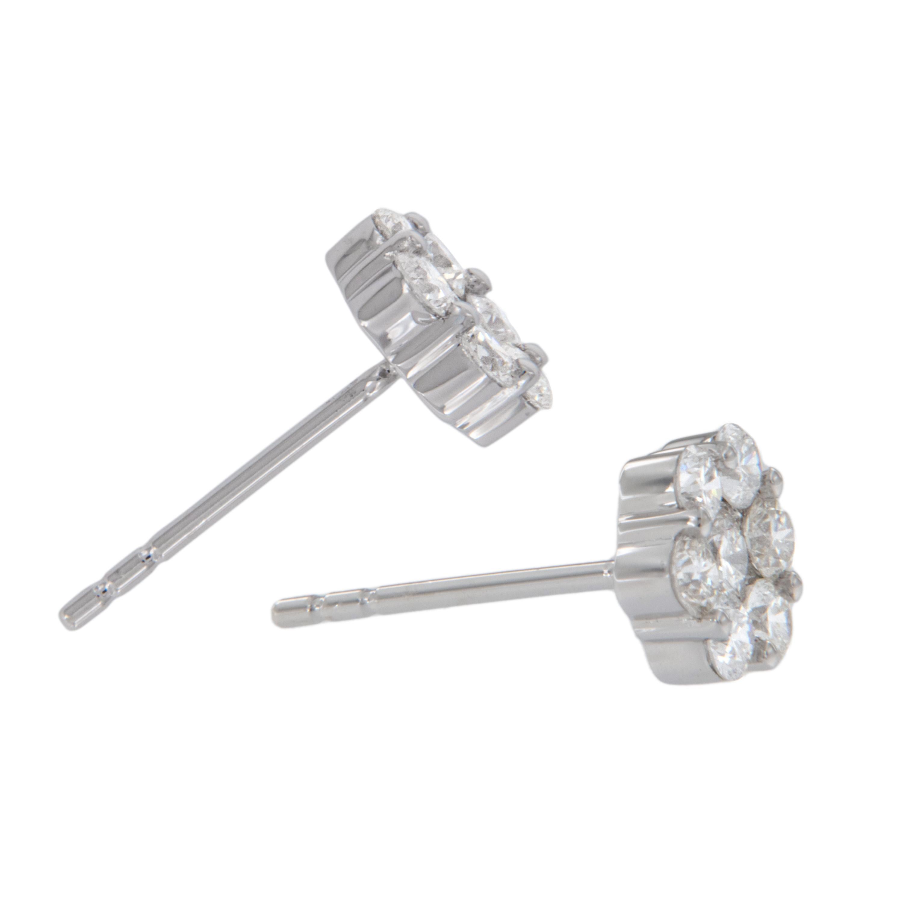 You can't go wrong with these fabulous cluster stud earrings! Made from fine 18 karat white gold & set with 0.25 Cttw of VS clarity & F-G color diamonds having posts & friction backs for security of wear. These classic earrings have a substantial