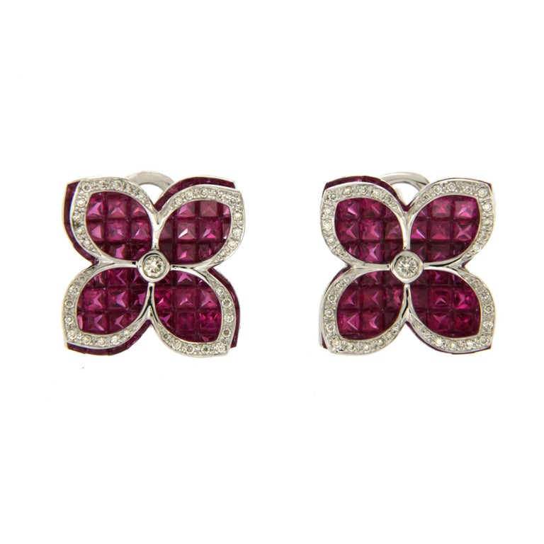 100% Authentic
Height: 17 mm 
Width: 17 mm
Metal: 18K White Gold
Hallmarks: 18K
Total Weight: 8.20 Grams
Stone Type: 9.86 CT Invisible Natural Ruby and 0.32 CT G VS2 Diamonds
Condition: New
Estimated Price: $13267
Stock Number: BL118