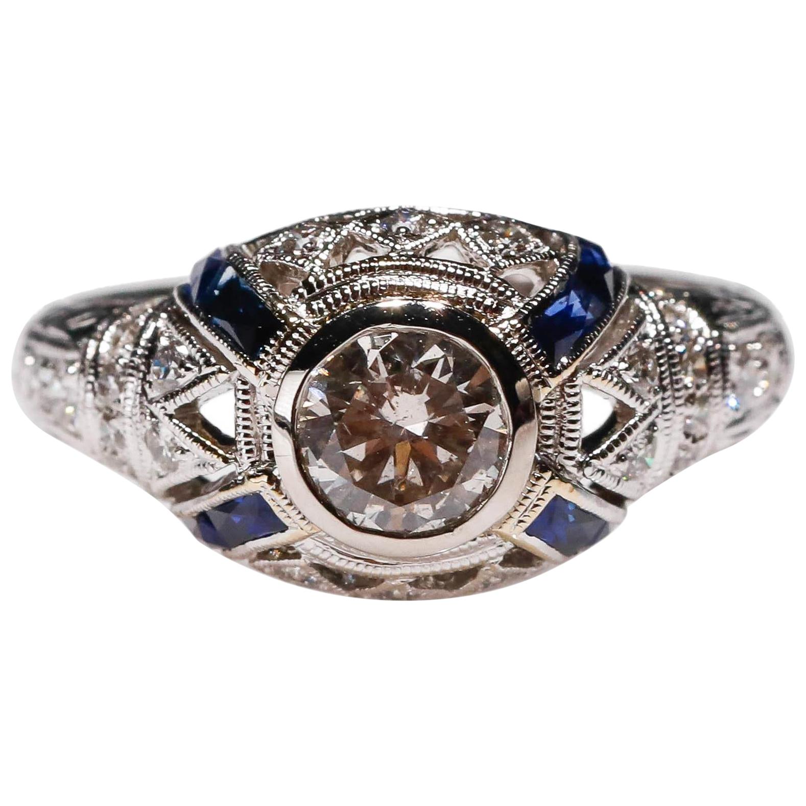 18 Karat White Gold 0.4 Carat Blue Sapphire 0.8 Carat White Diamond Halo Ring For Sale