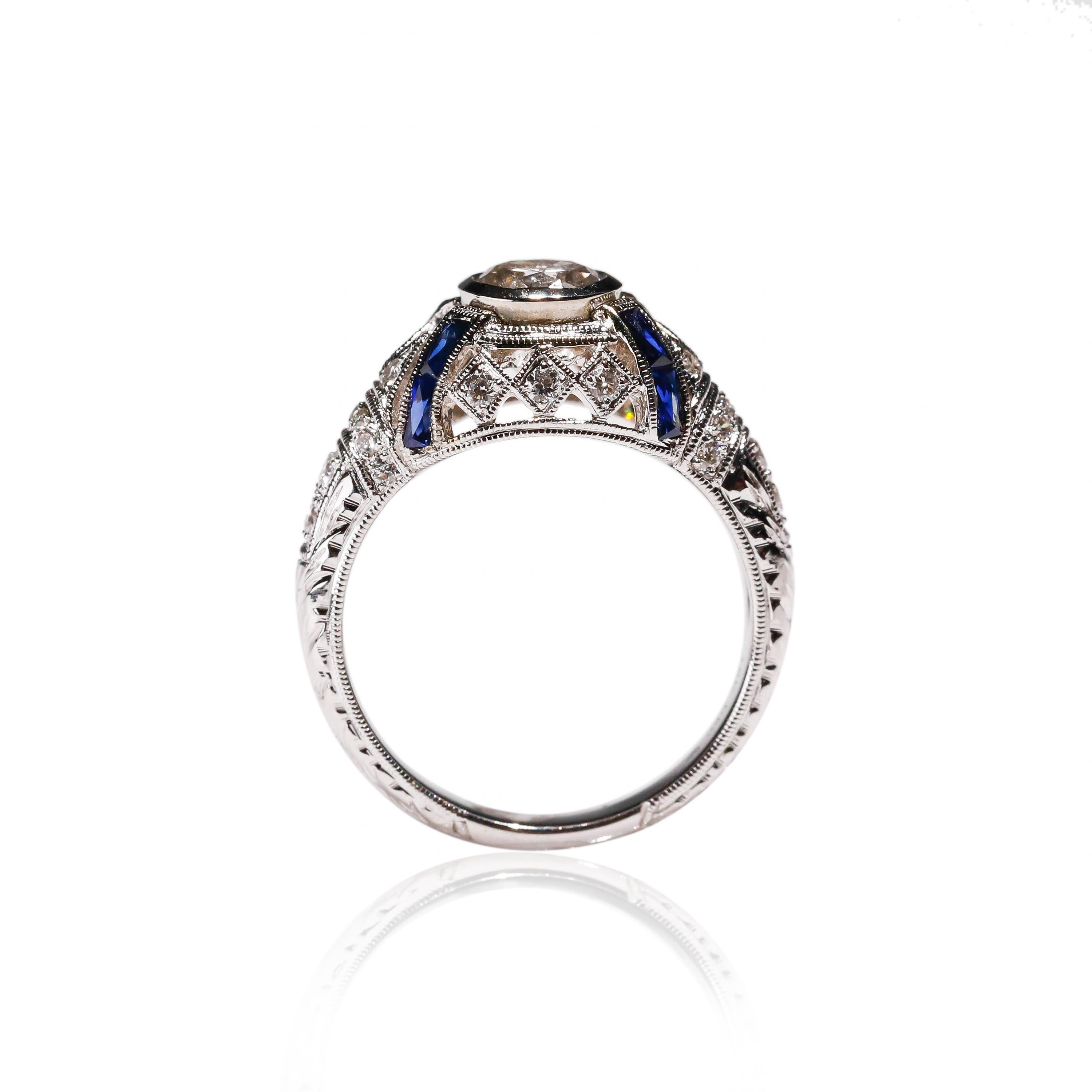 Art Deco 18 Karat White Gold 0.4 Carat Blue Sapphire 0.8 Carat White Diamond Halo Ring For Sale