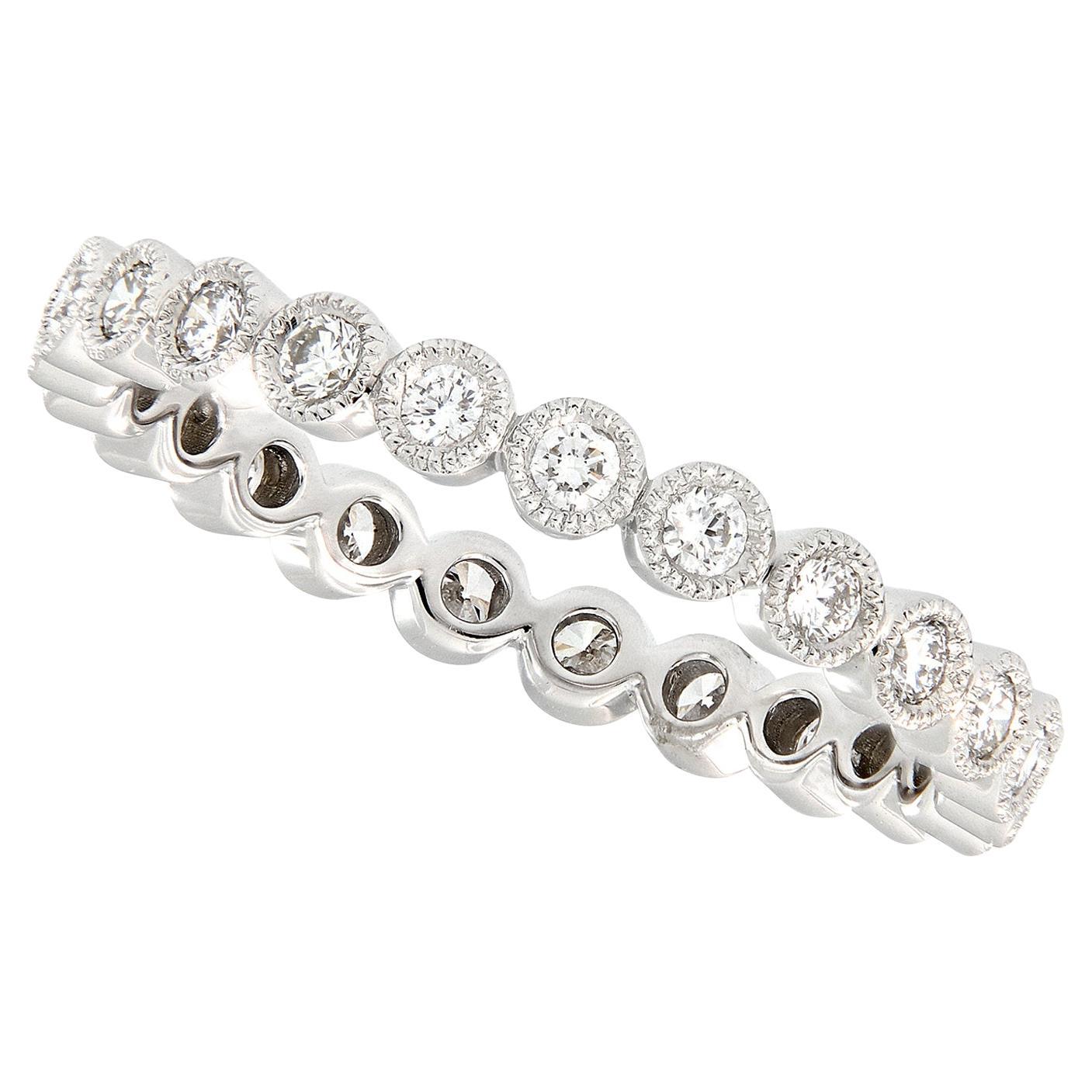 Created from bright 18 karat white gold, this beautiful eternity band boasts 23 fine round brilliant cut diamonds = 0.42 Cttw each individually set in milgrain edged bezels for a stunning look on its own or check out our white and rose gold matching