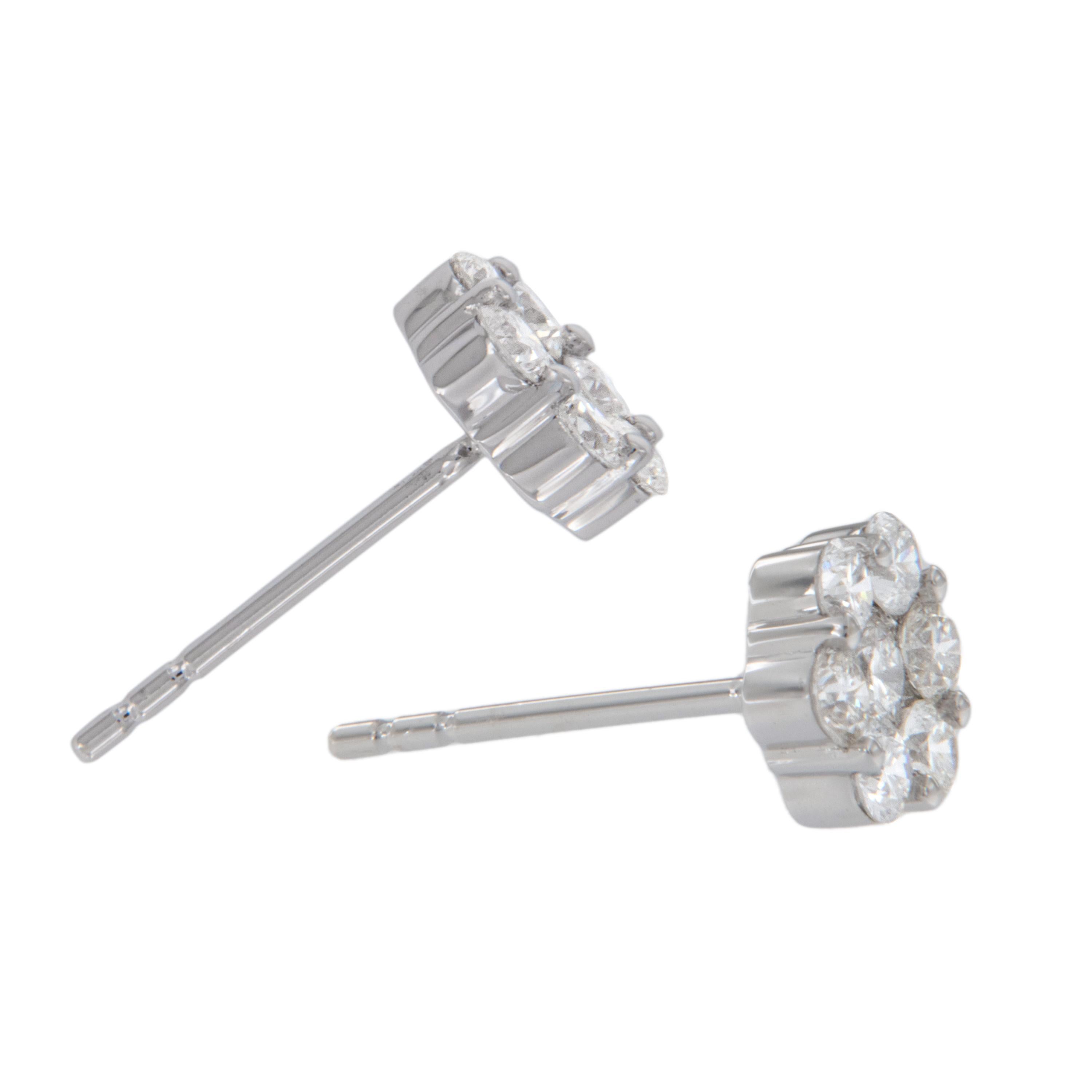 You can't go wrong with these fabulous cluster stud earrings! Made from fine 18 karat white gold & set with 0.75 Cttw of VS clarity & F-G color diamonds having posts & friction backs for security of wear. These classic earrings have a substantial
