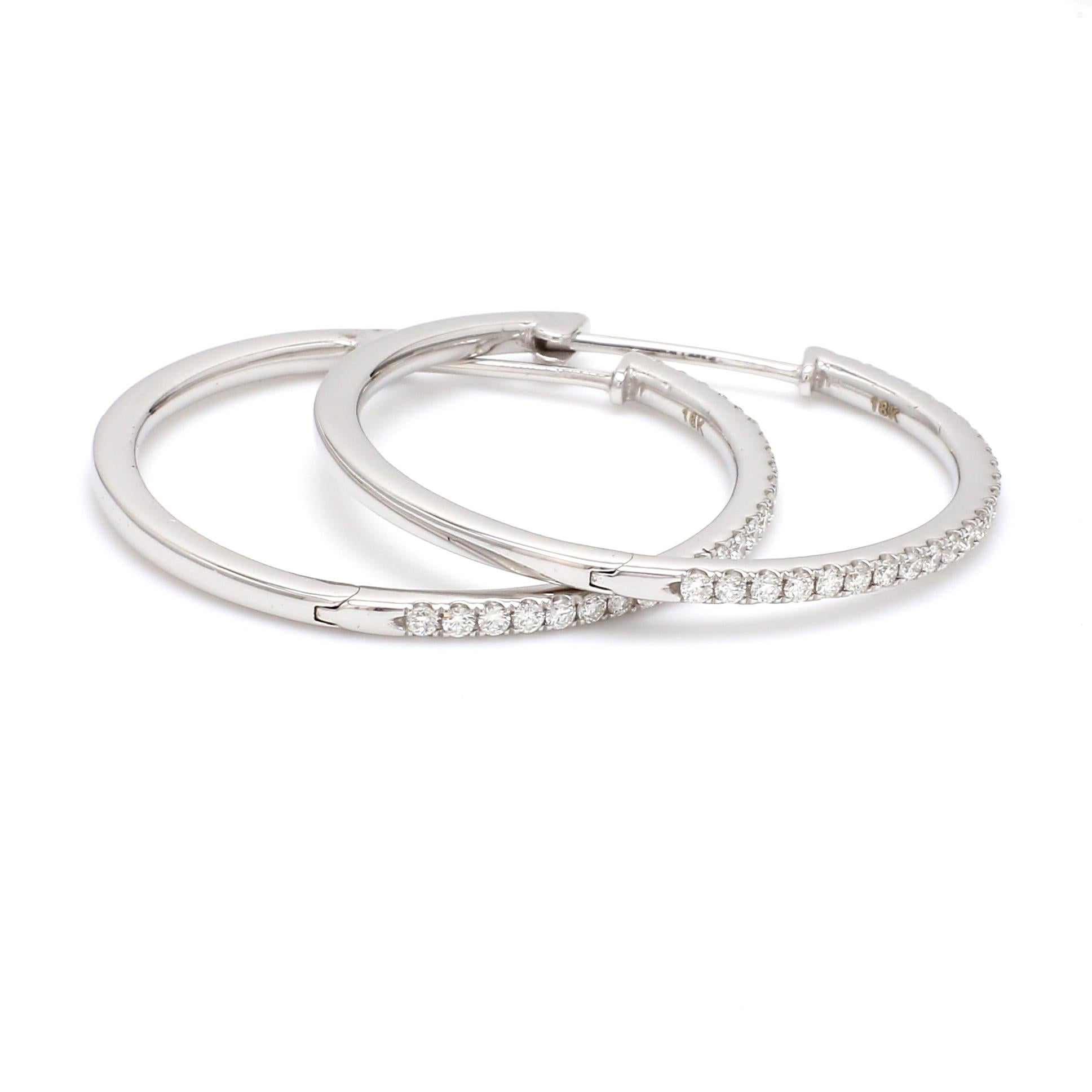 A Beautiful Handcrafted Hoop Earring in 18 karat White Gold with Natural Brilliant Cut Colorless Diamond . A Statement piece for Evening Wear

Natural Diamond Details
Pieces : 50 Pieces
Weight : 0.55 Carat 
Clarity of Diamond : VS
Colour of Diamond